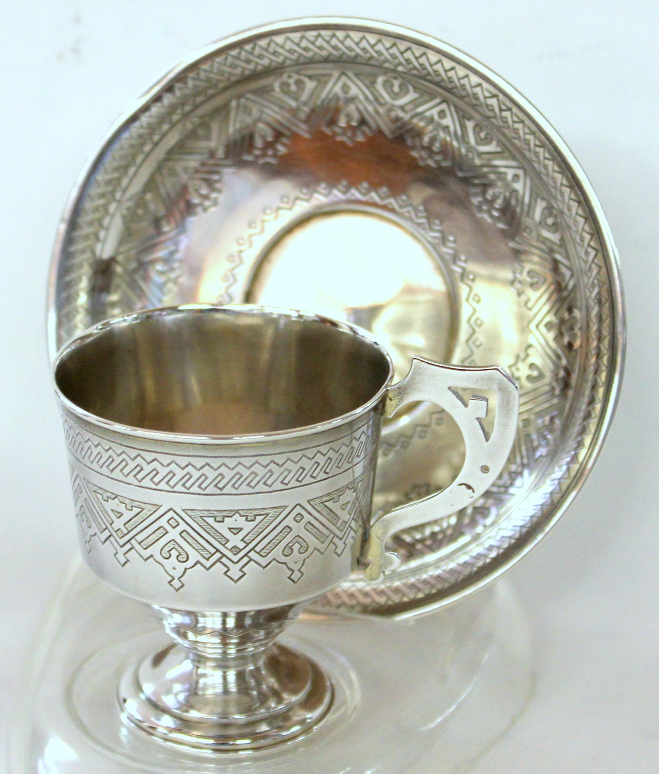 Rare and fine antique Imperial Russian .875 fine silver hand engraved cup and saucer.
Maker's marks for Aleksandr Fuld, Moscow, and Master Assayer's mark for Aleksandr Nikolayevich Krollau, Vilnius.

Cyrillic maker's mark and master assayer's
