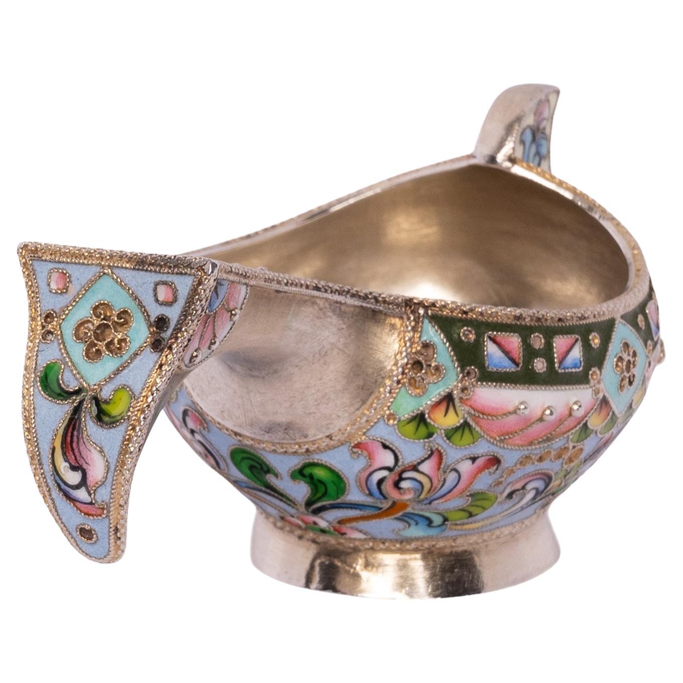 A very good antique Imperial Russian silver-gilt cloisonne enamel kovsh, Moscow, circa 1908.
The kovsh of traditional shape with all over muti-color cloisonne enamel decoration, the kovsh having both floral & geometric cloisonne decoration to the