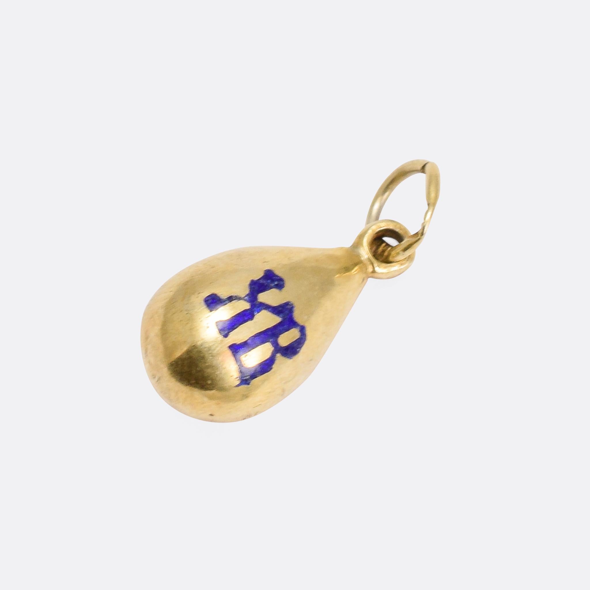 A fine antique miniature egg pendant modelled in silver gilt with blue enamelled lettering. The XB motif stands for Christos Anesti, or Christ is Risen. 

MEASUREMENTS 
16.1 x 8.5mm

WEIGHT 
1.8g

MARKS 
Stamped 84 (Russian silver)