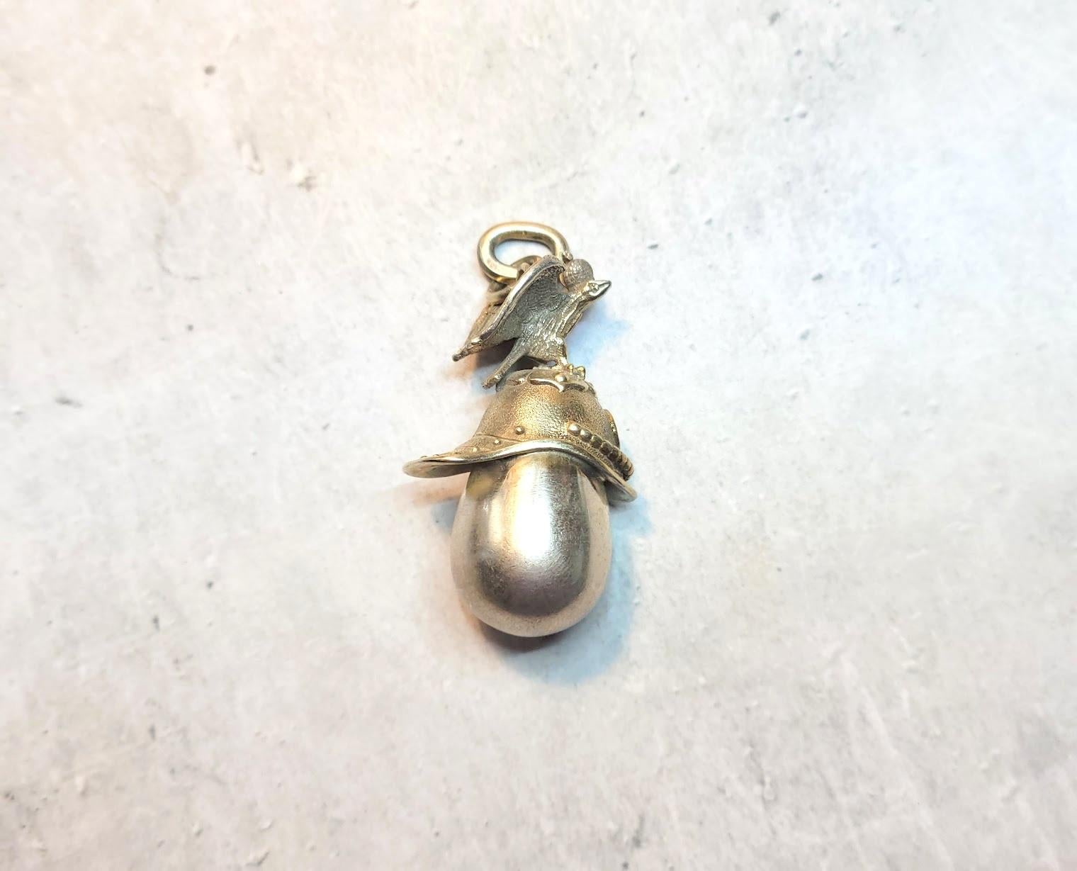 We present a fabulous quality egg pendant in the form of a miniature gilt helmet with a double-headed eagle, globus cruciger, and the historical Imperial coat of arms of Moscow - Saint George. The pendant is made of 84 imperial gilt silver. It is