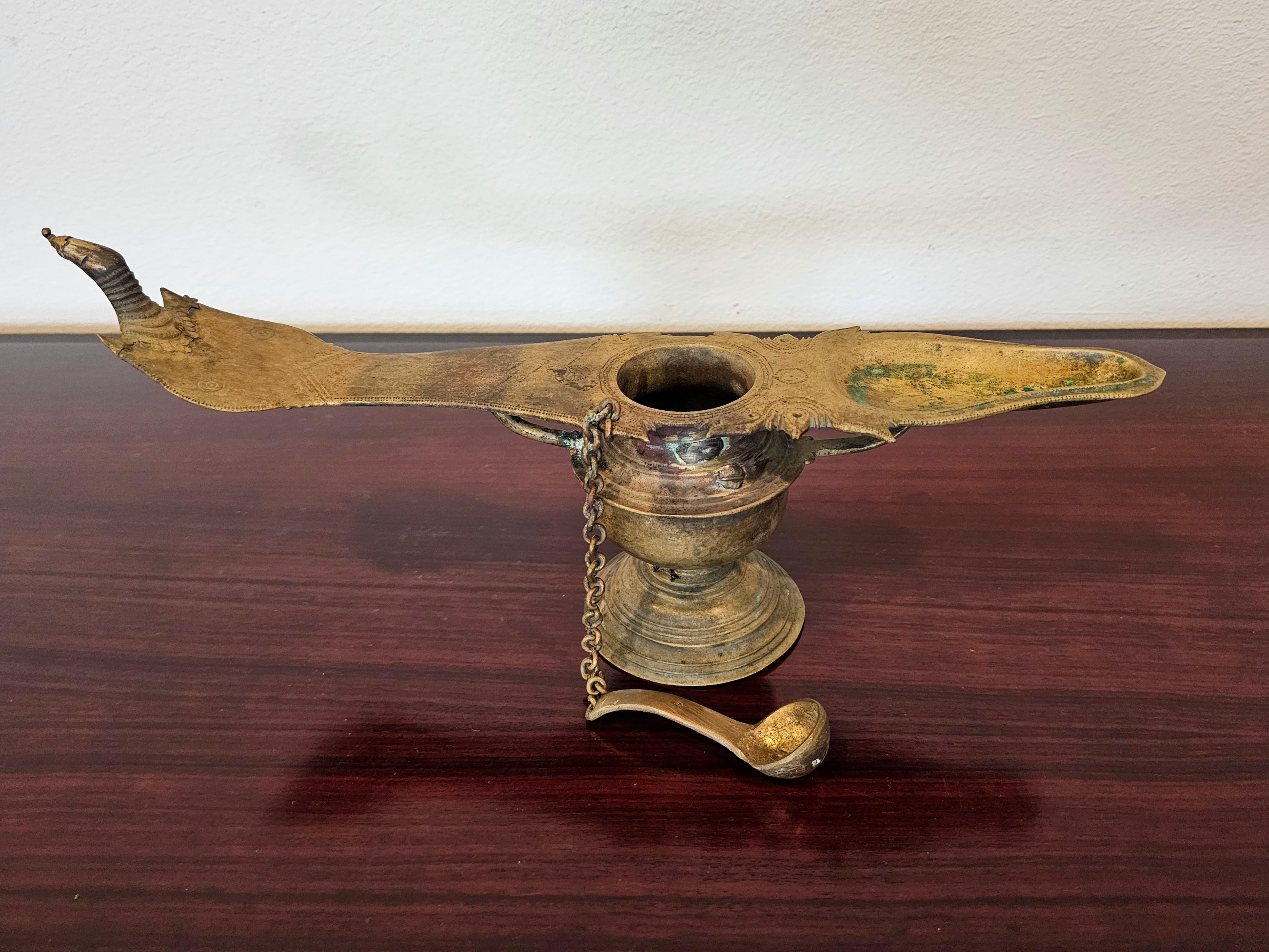Indian Antique India Patinated Brass Changalvetta Hindu Ritual Oil Lamp with Ladle For Sale