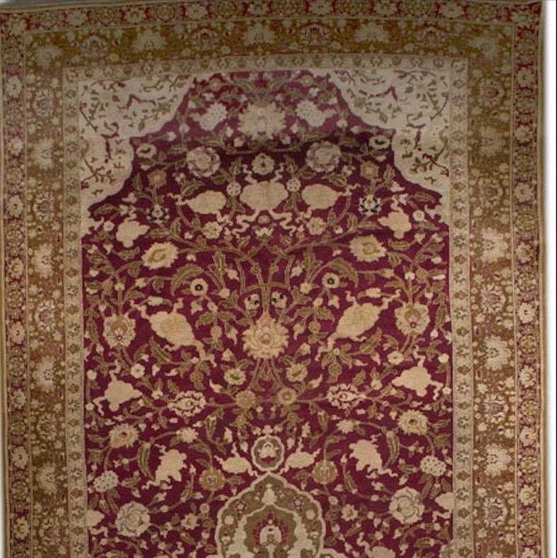 The truly unique and grand size of this piece adds to its importance and dramatic impact. The central medallion sitting on the Agra red ground filled with light colored floral designs helps create a sense of completeness when matched with the