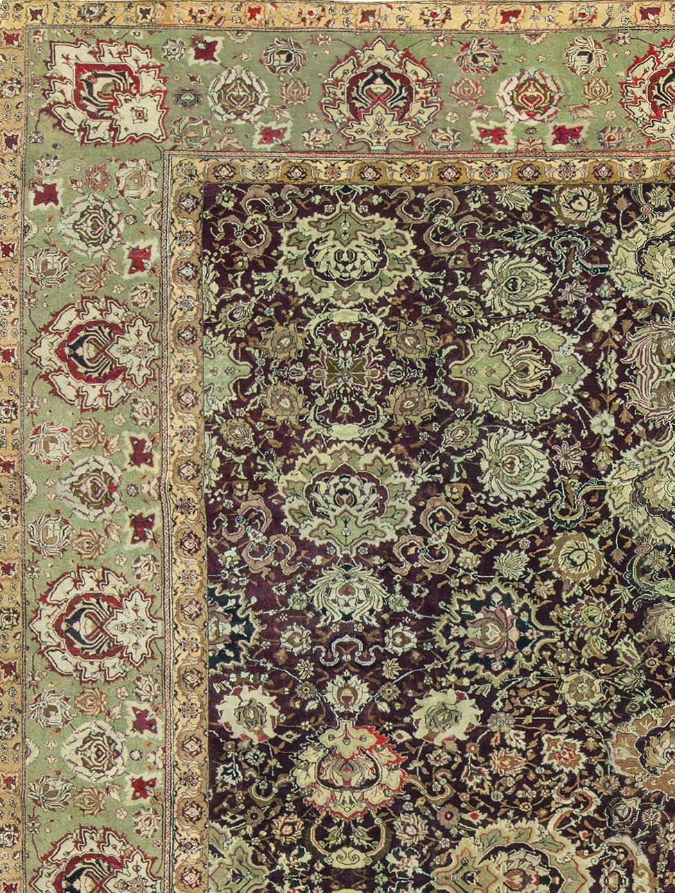 This is a marvelous example of an antique Agra. Handwoven in the 1880s the color is the typical and famous Agra red surrounded by an intricate green border to create this overall magnificent looking piece. During much of the history of the Mongol