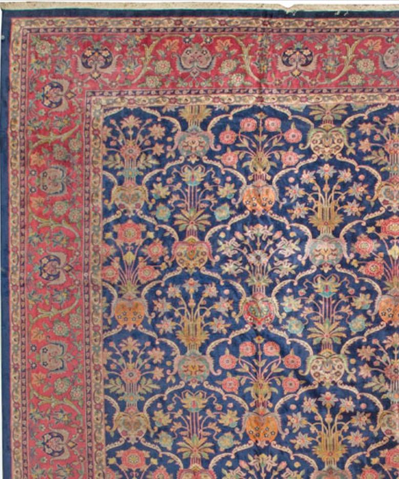 During much of the history of the Mongol Empire, Agra was its capital city. Agra carpets are fine rugs of the highest quality and highly sort after, by both collectors and designers. This rug is a fine example with its main field in navy filled with