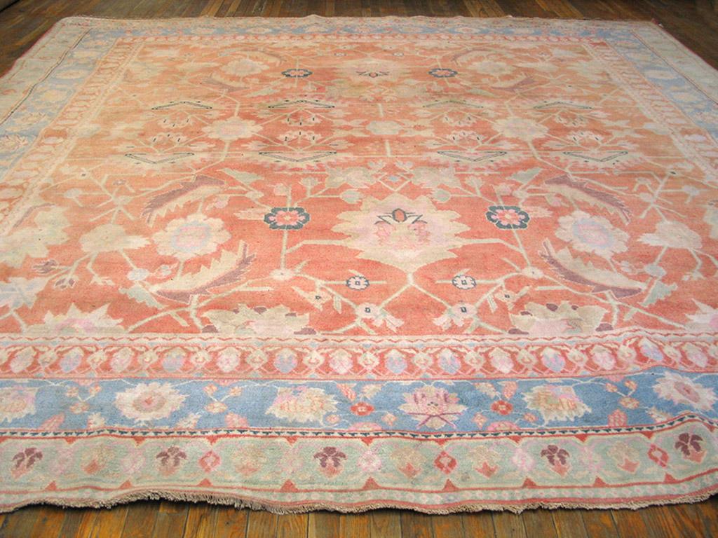 Early 20th Century Indian Cotton Agra Carpet ( 12' x 12' - 365 x 365 )
Antique Indian Agra Cotton Rug with a peach background.
Boldly drawn and somewhat angular like a Persian Heriz, but this antique northern Indian urban carpet shows a rare salmon