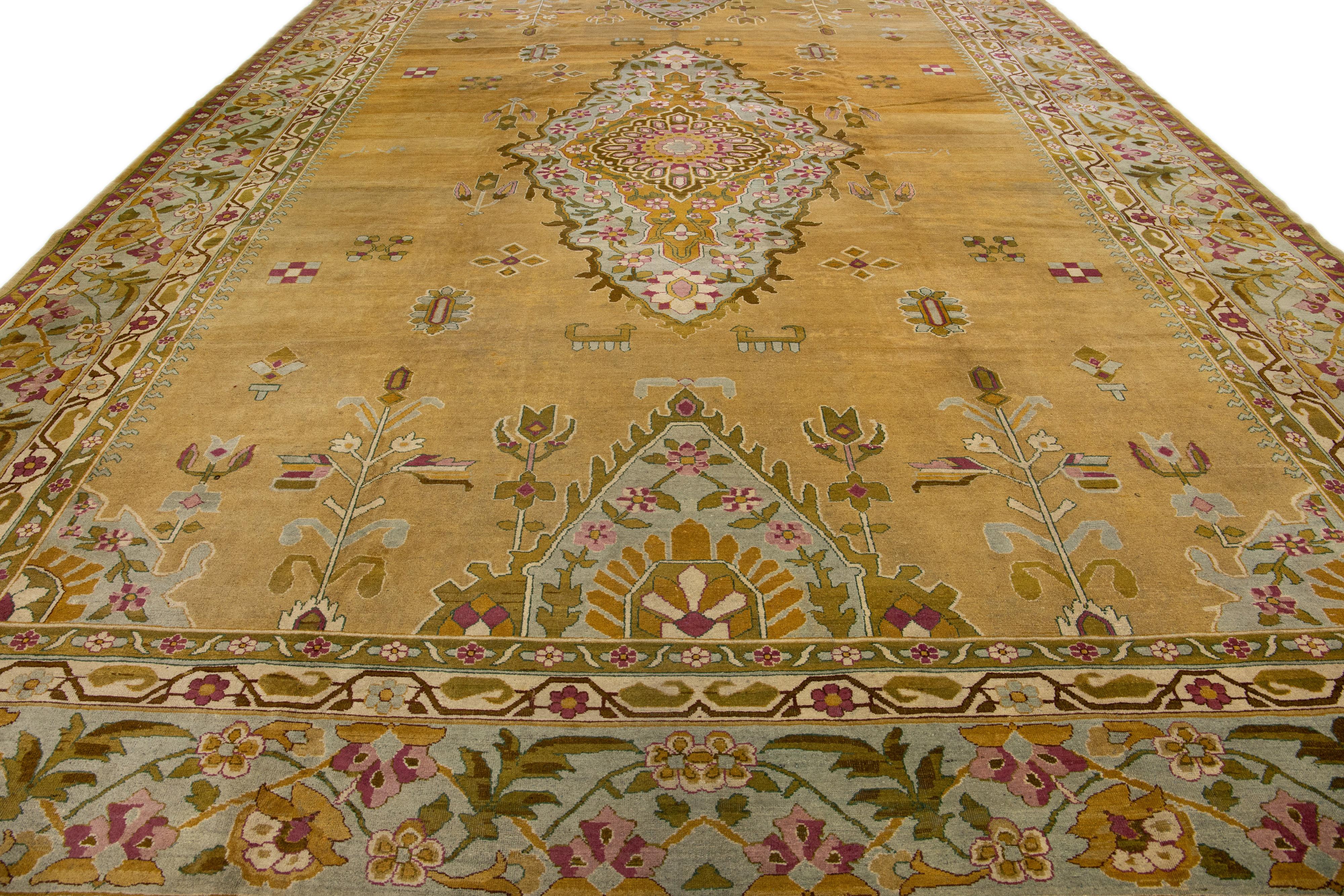 Anglo-Indian Antique Indian Agra Handmade Goldenrod Wool Rug with Medallion Design For Sale