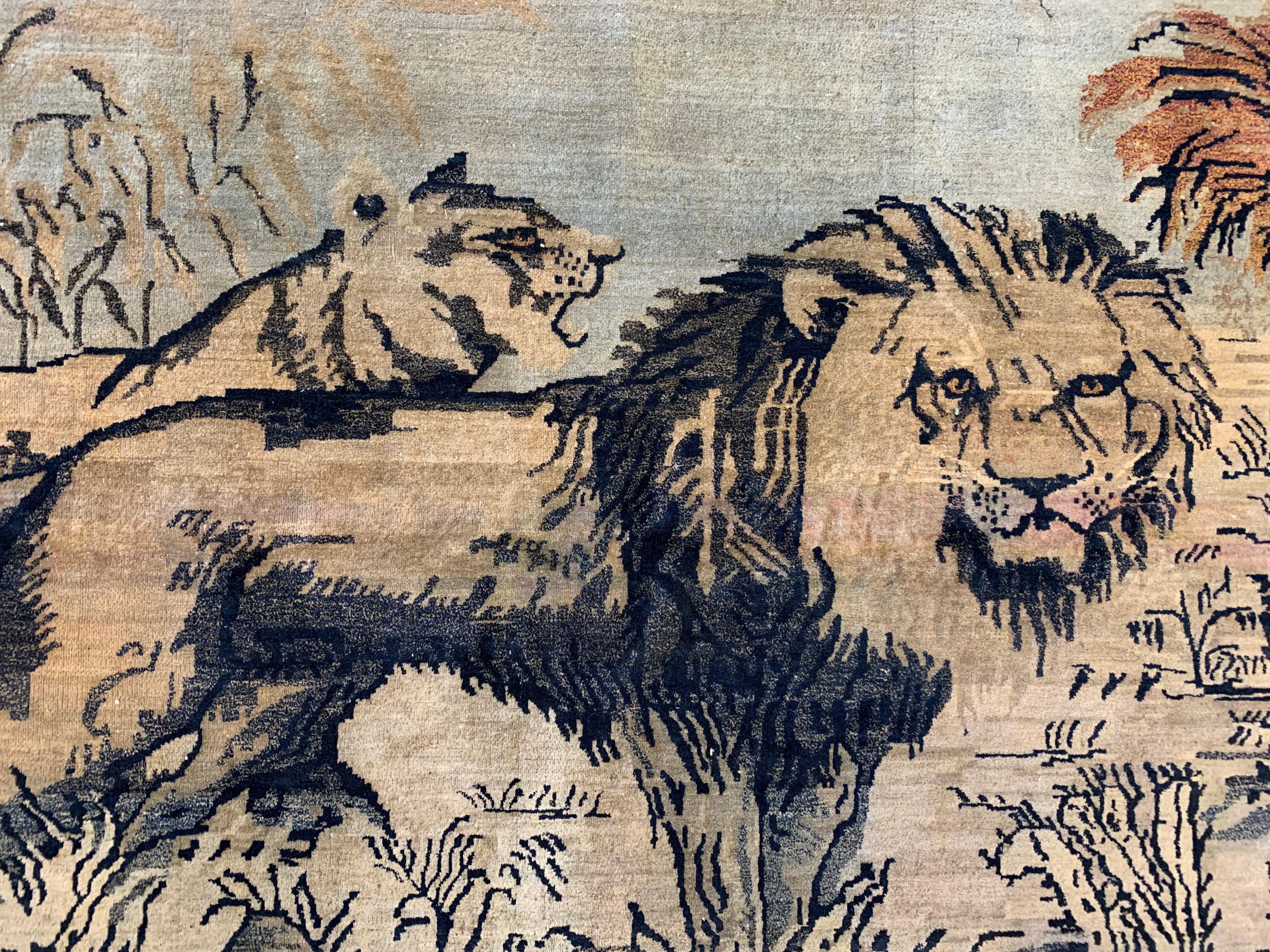 Antique Indian Agra pictorial rug featuring a lion and lioness.

circa 1900

Measures: 4'1