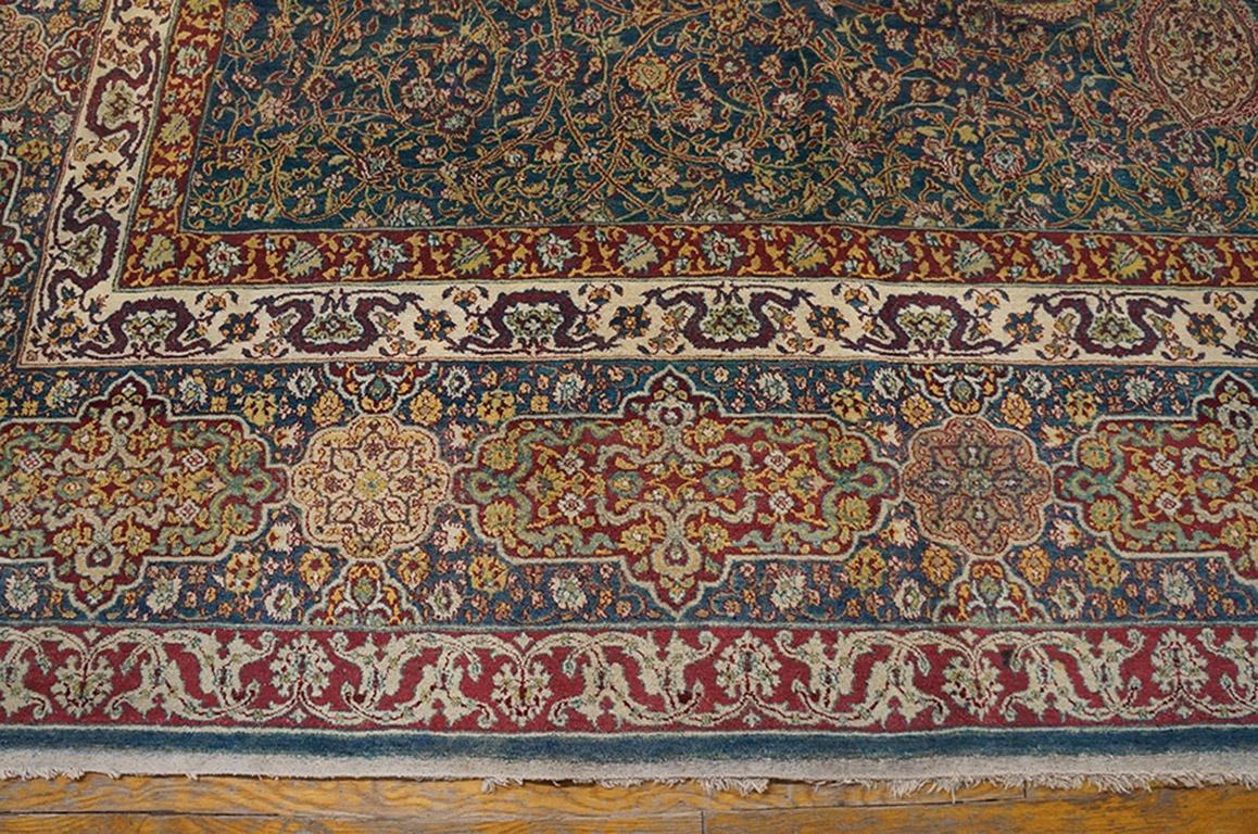 The whole 35 feet of the Ardebil carpet, medallion, field arabesques, lamp pendants and cartouche/octofoil border has been compressed into this more convenient room size antique Indian city carpet with a blue-green field instead of the archetype’s