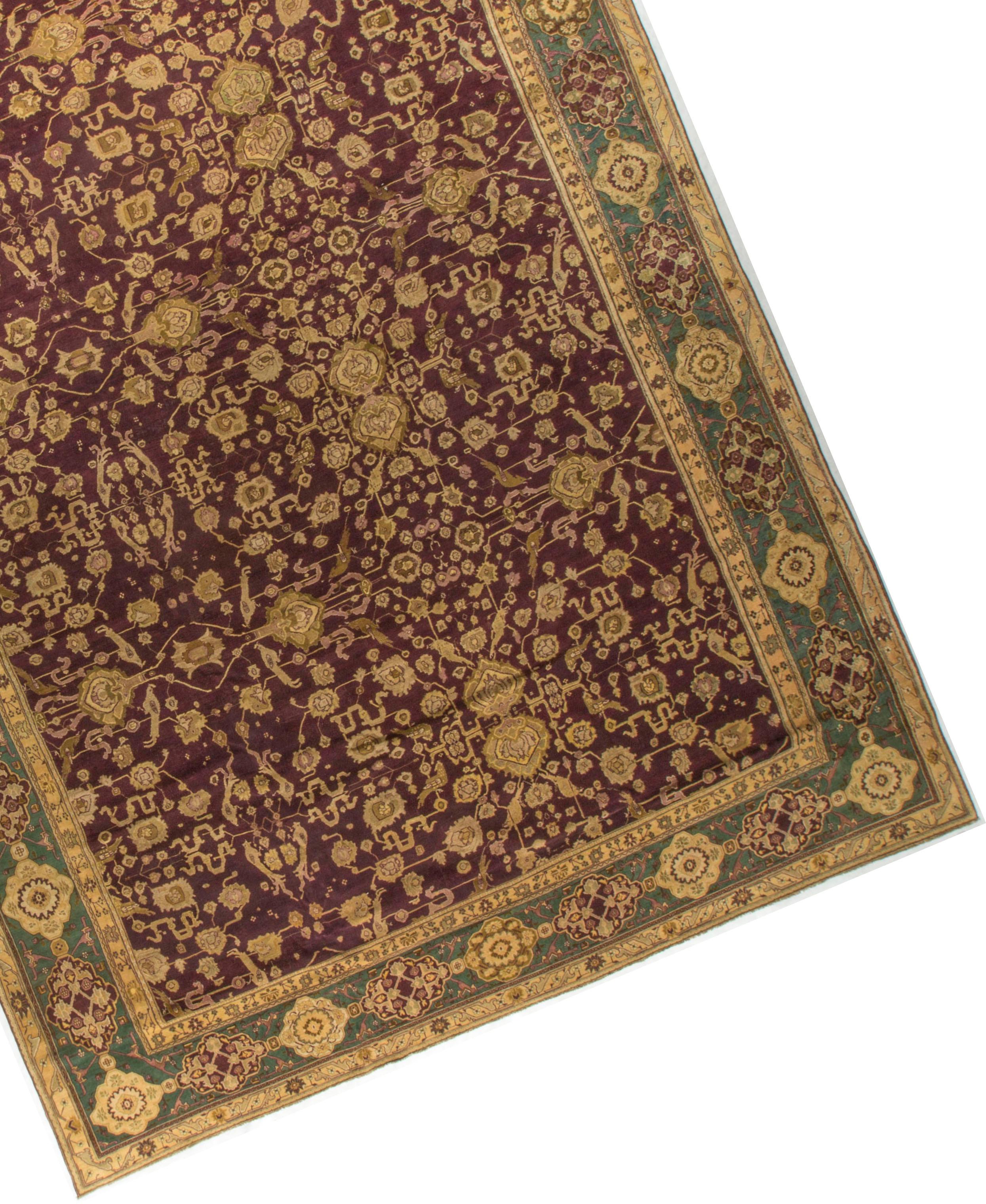 Antique Indian Agra rug, circa 1890. The field filled with floral designs of so many different styles, is so well offset by the green border. The weaving and design skills used in the central theme is truly outstanding.Agra carpets are fine rugs of