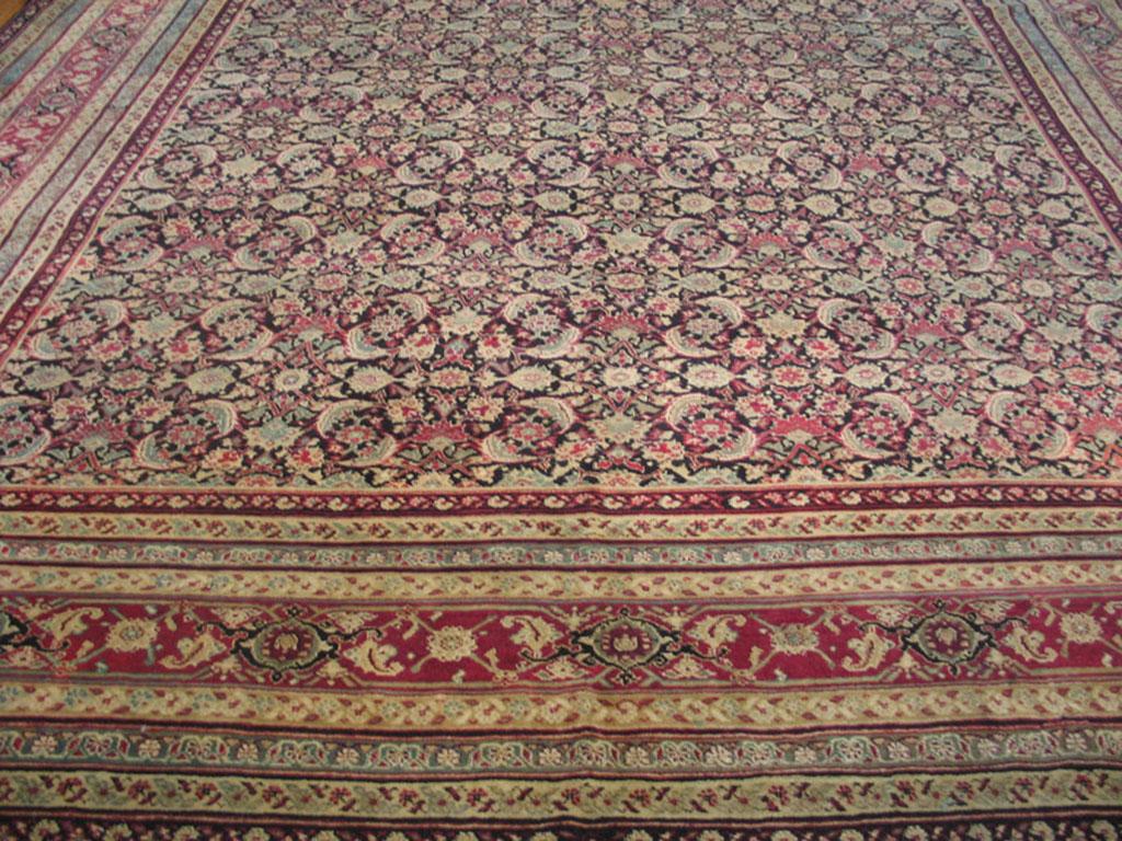 The rich deep brown field displays a very close rendering of the classic allover Herati pattern of open diamonds, ‘fish’ leaves and palmettes, while the nine patterned borders of this good condition antique northern Indian city carpet is centred by