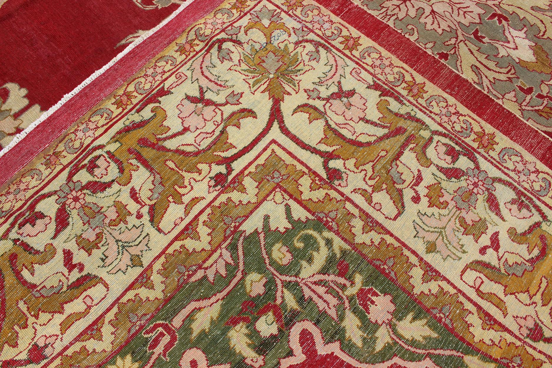 Indian Agra Antique Rug with Center Medallion in Green, Red, and Gold Colors In Good Condition For Sale In Atlanta, GA