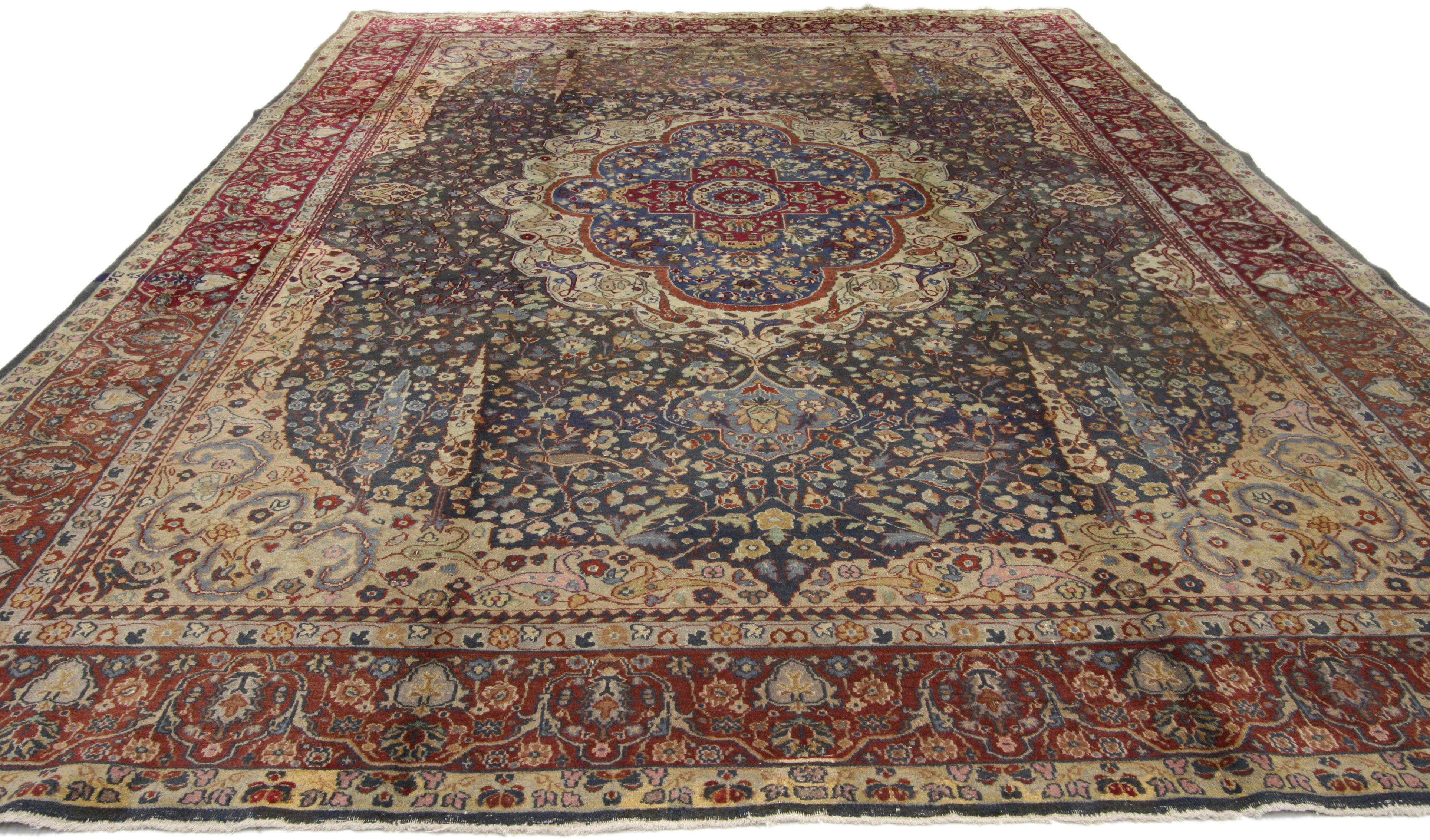 71743, antique Indian Agra rug with cypress trees. This hand-knotted wool antique India Agra rug features an eight-point cusped medallion filled with a ruby red cruciform cross motif dotted with blooming palmettes on a blue background. The blue