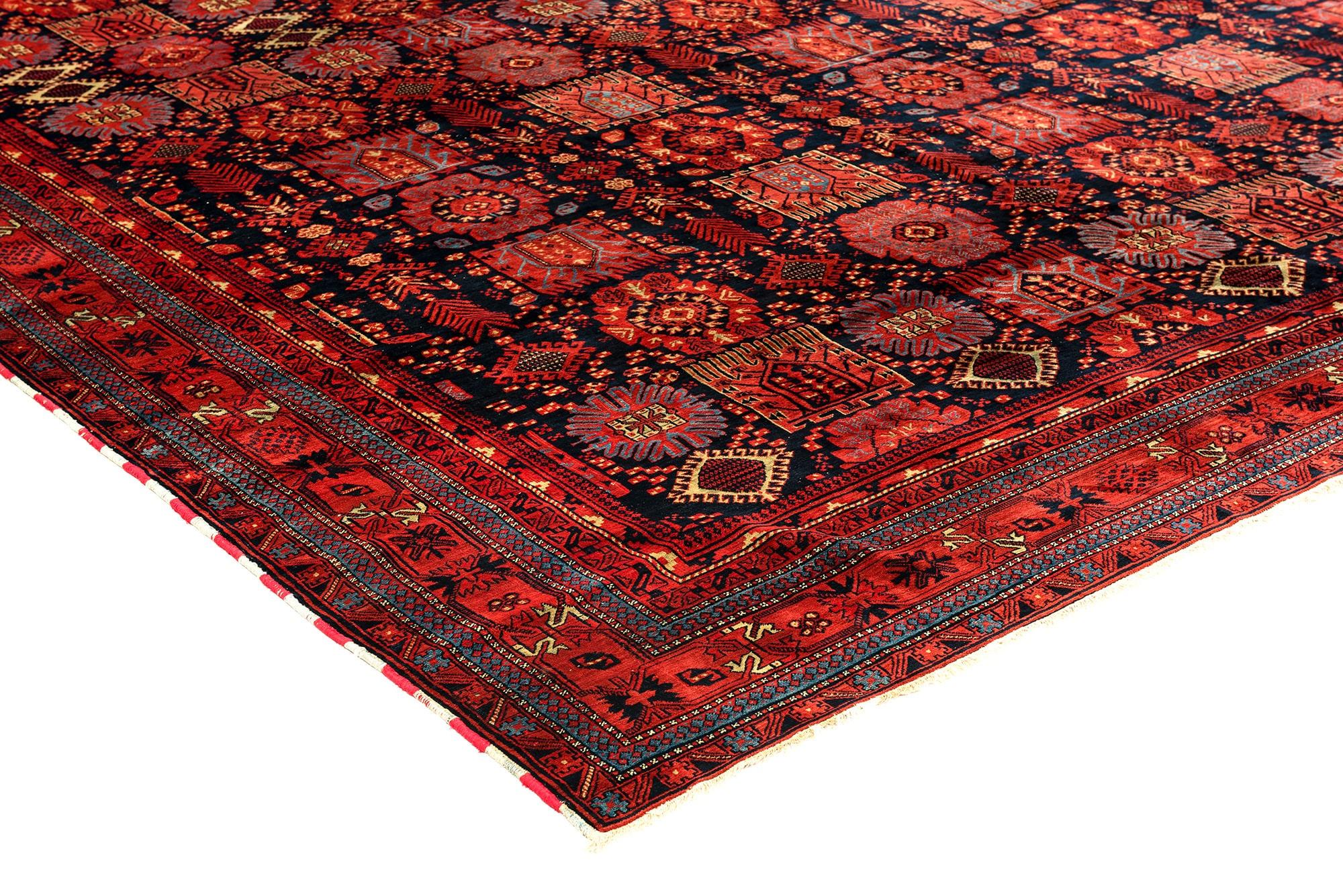 The city of Agra was not only famous for the Taj Mahal, but also for some of the most unusual and decorative carpets. This authentic antique Agra with a design heavily influenced by the Turkmen and Beluchi tribal carpets from Turkmenistan stands out