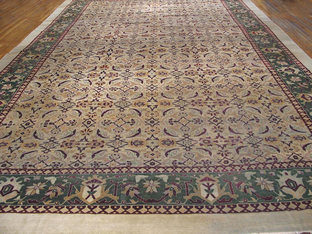 The perfectly balanced herati pattern of rosettes and curved leaves neatly fills the straw yellow field of this antique c.1890 Indian carpet, all enframed by an unusual version of the classic turtle palmette as the main border motif. The minors are