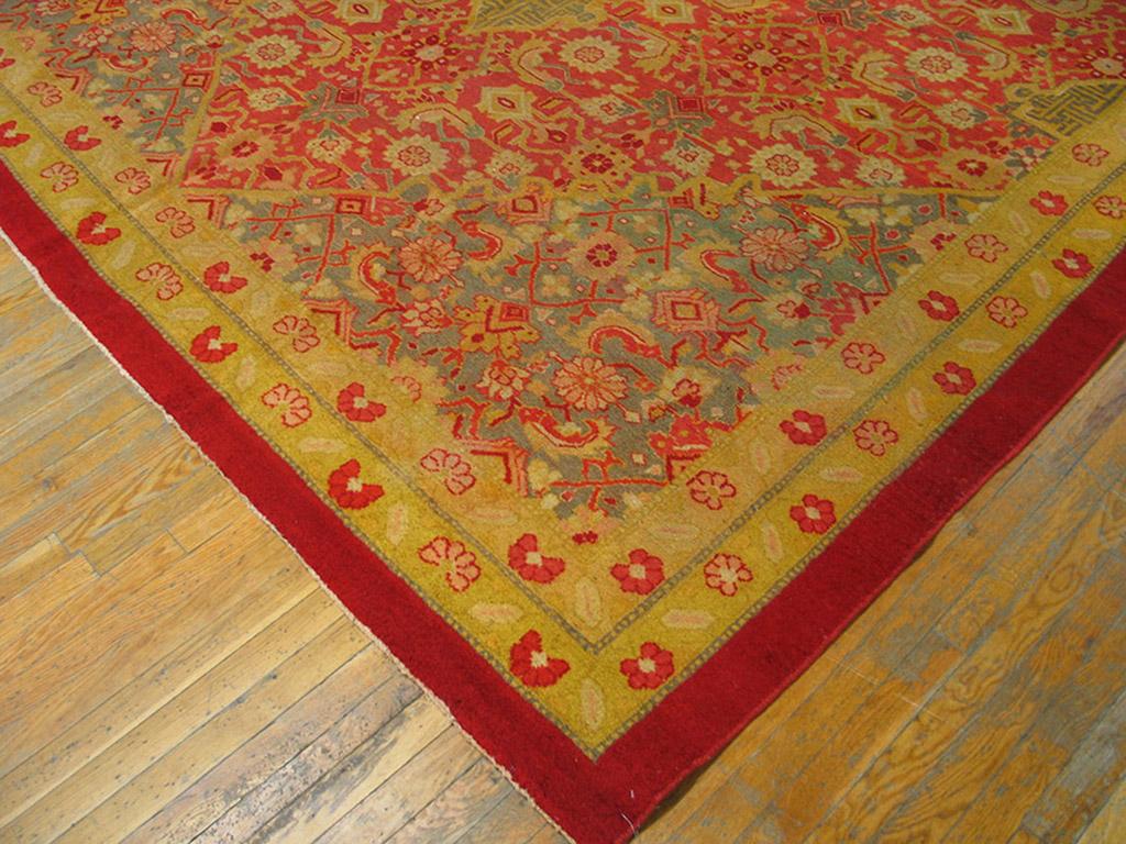The field abrashes from coral to red and supports an all-over Herati pattern exactly matched in scale by that of the medallion. Unusual fret pendants. Red plain outer stripe and two matching reversing fan palmette inners. Antique in good condition.