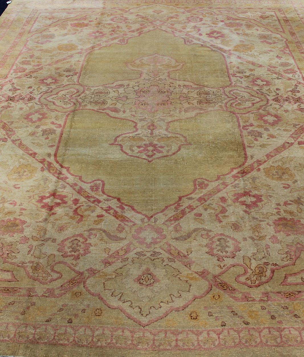 Antique Amritsar Rug With Medallion Design in Acidic-Yellow Green, Pink, Ivory. Keivan Woven Arts /  rug / J10-0301 / country of origin / type: India / Amritsar, circa Early-20th Century. Antique Amritsar, antique Agra.
Measures: 10'7 x