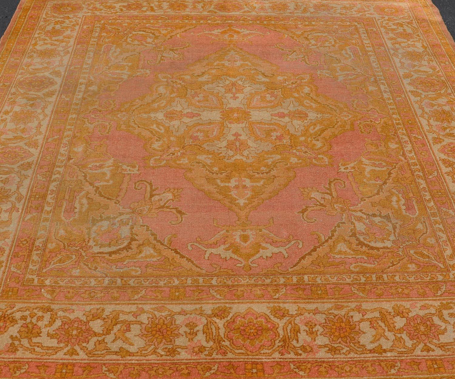 Antique Indian Amritsar Rug in Acidic Yellow, Pink and Ivory With Medallion. Keivan Woven Arts rug / X23-0303-362 /  1920 circa / Antique Amritsar, Antique Agra.
Measures: 8'1 x 9'10 
The pink, yellow, and ivory hues of this antique Indian Amritsar