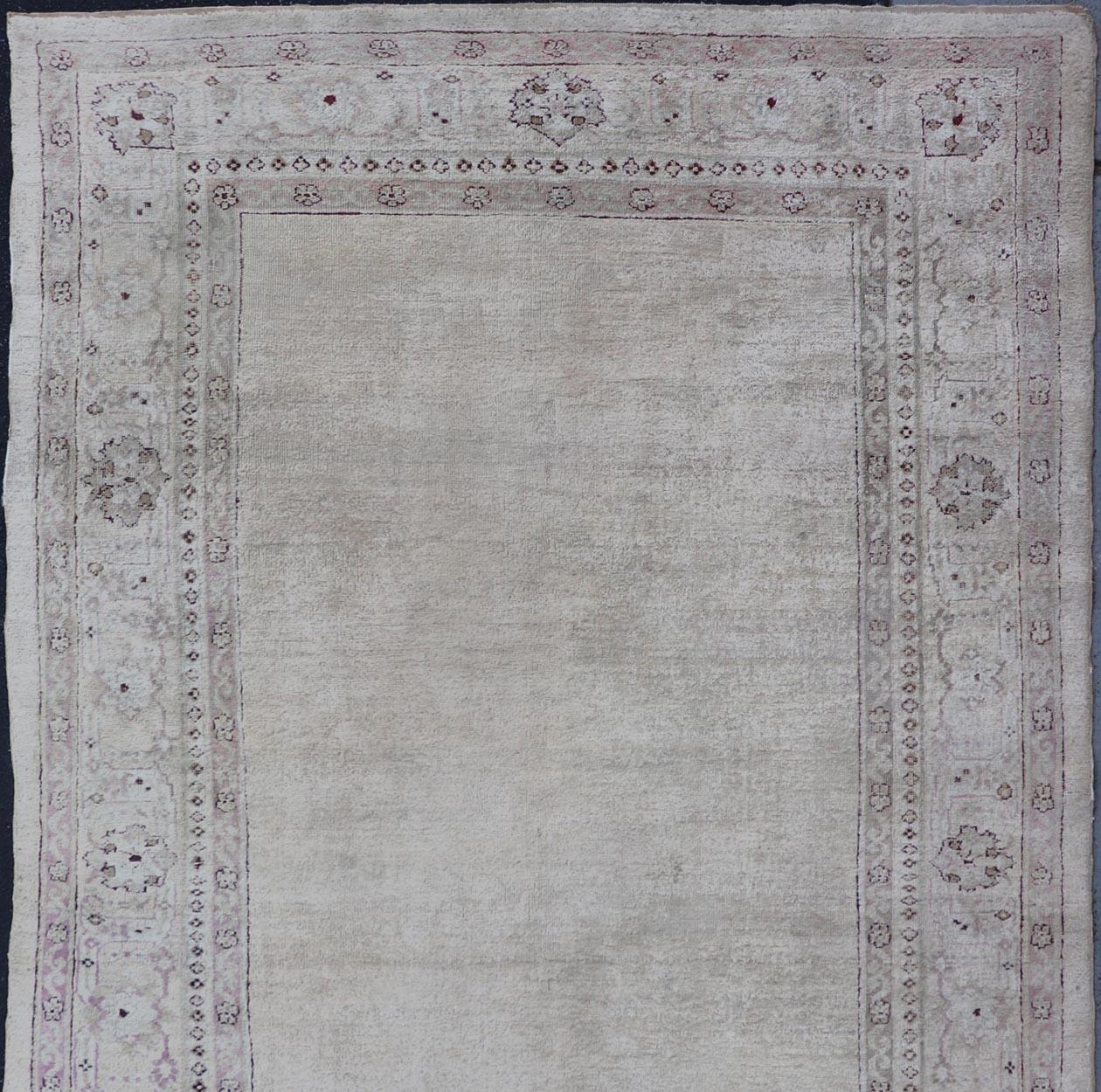 20th Century Antique Indian Amritsar Rug with Cream Background, Red & Lavender Border For Sale