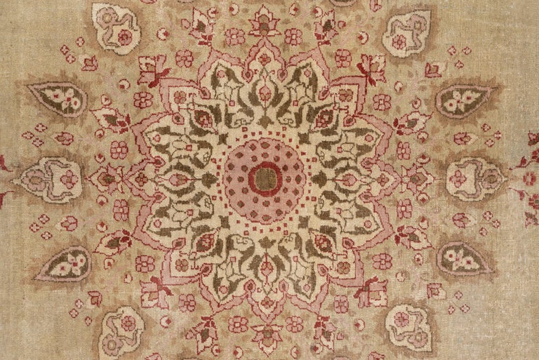 The straw-ecru open field displays a multiply pendanted round medallion with extra vase pendants and en suite quarter corners, all in a general Ardebil carpet pattern. Cartouche and straw main Border. Medium urban weave. Cotton foundation.