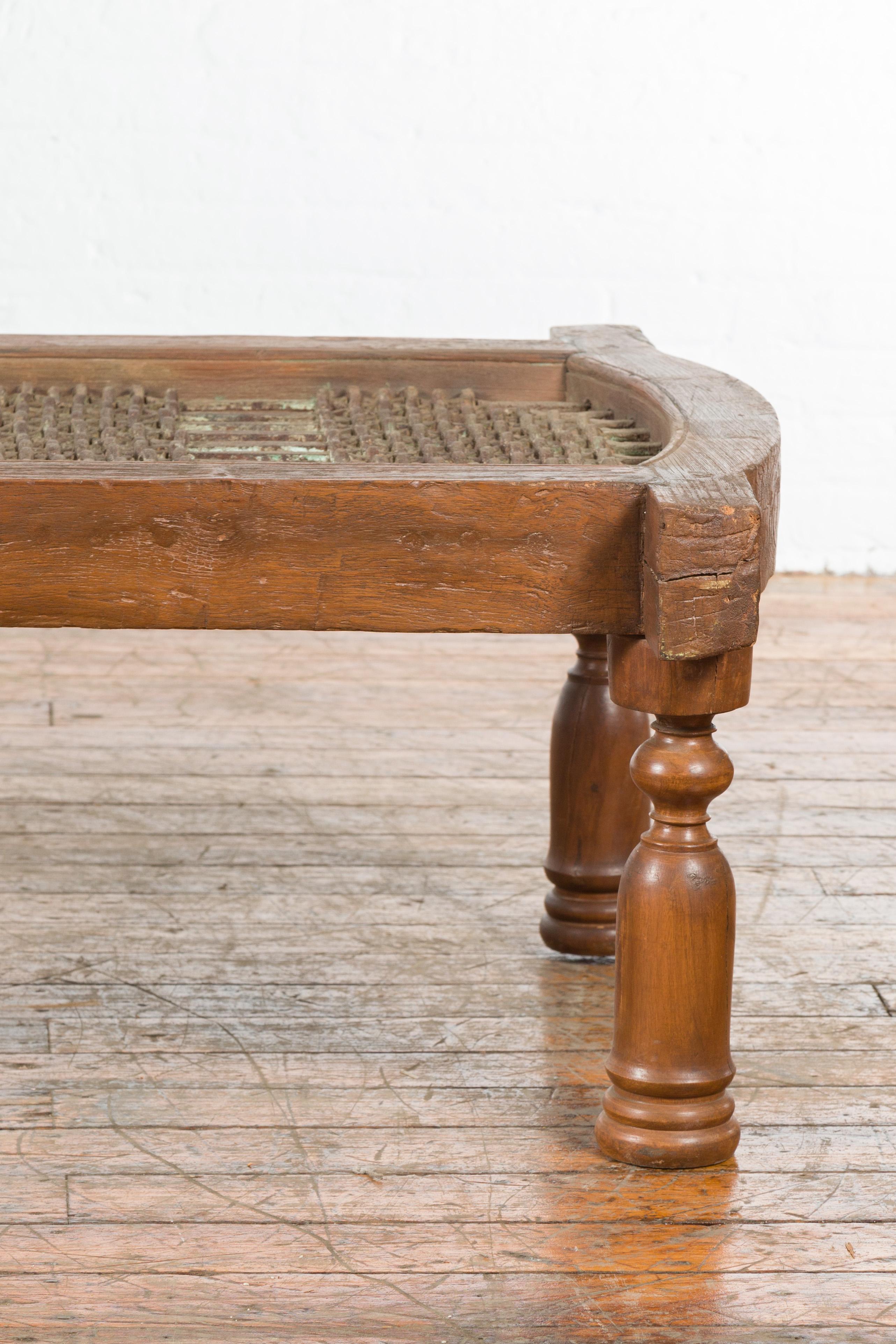 Rustic Antique Indian Arched Window Grate Made into a Coffee Table with Baluster Legs For Sale