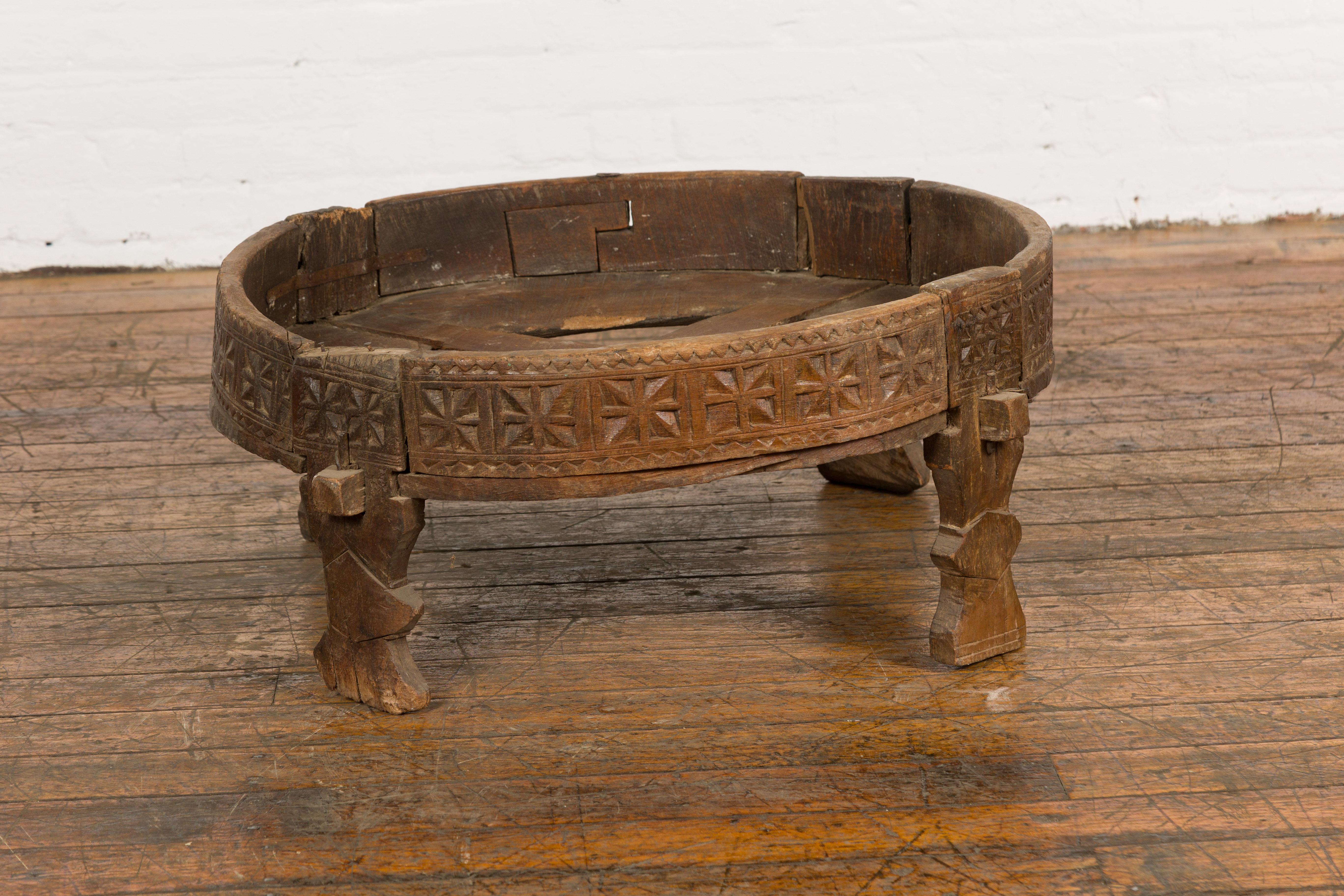 Tribal Antique Indian Chakki Grinding Table with Hand-Carved Geometric Décor For Sale