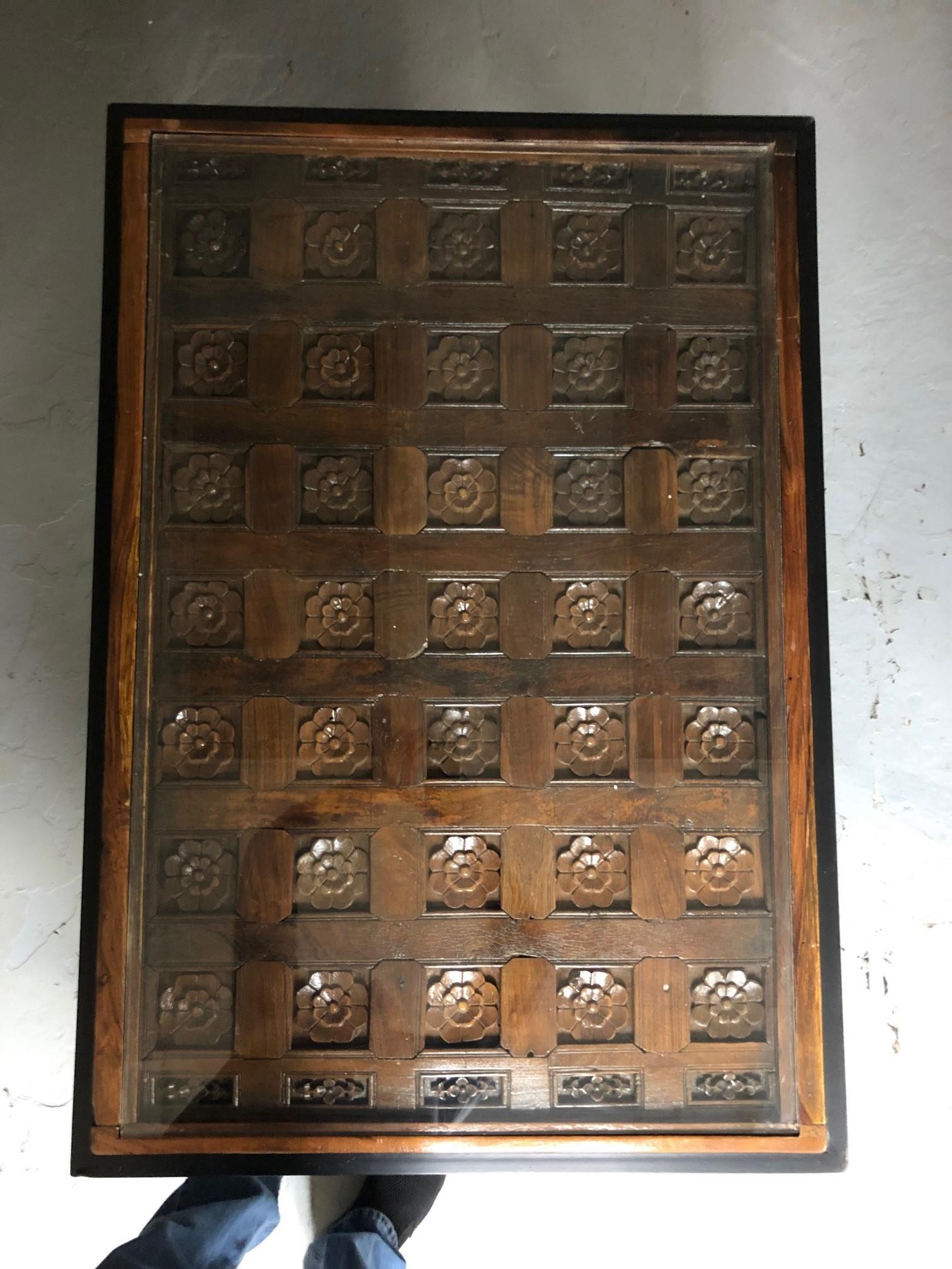 Antique Indian Courtyard Door Panel Made into a Accent or Coffee Table Iron base In Good Condition In Stamford, CT
