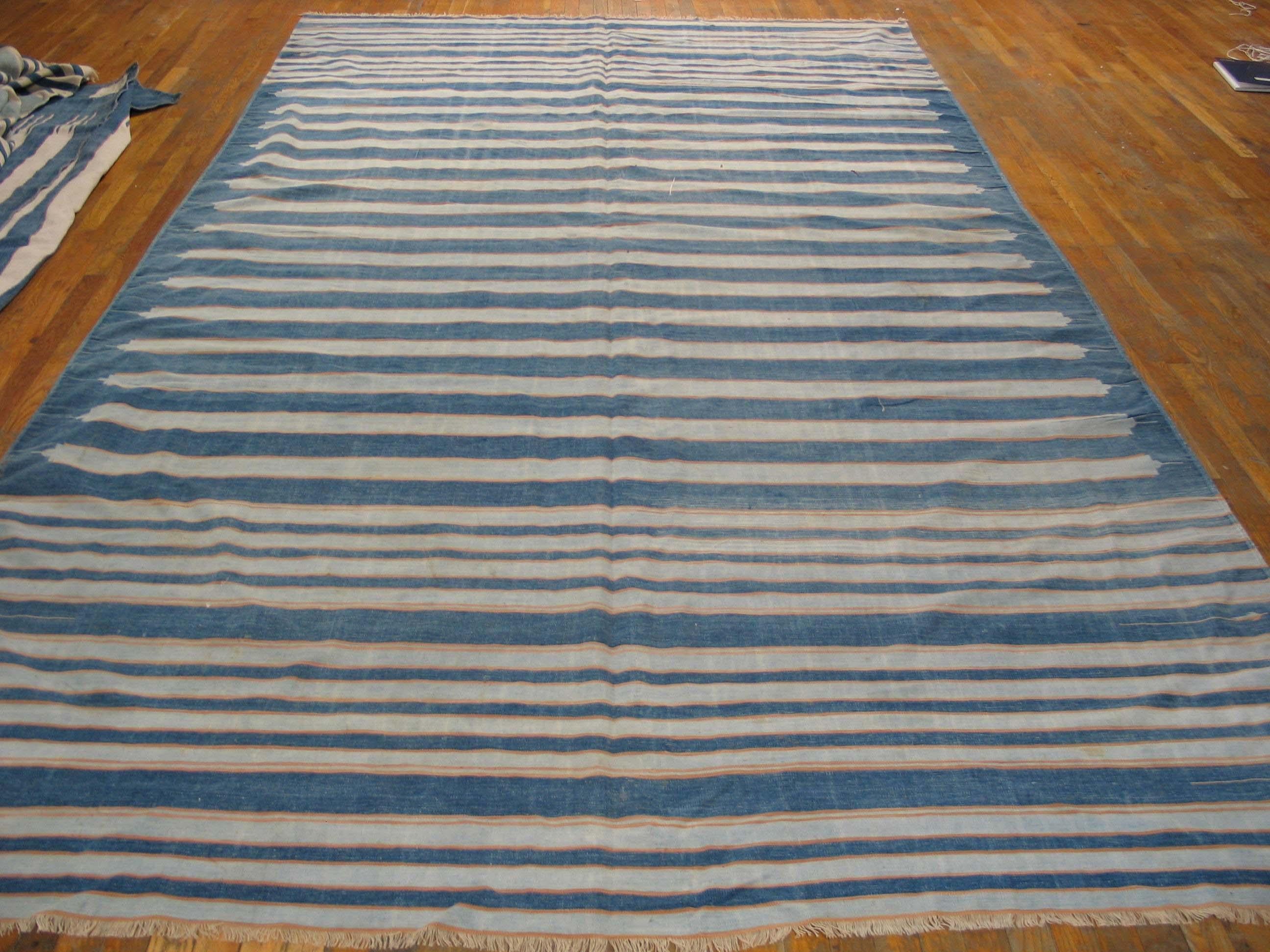 We have a dhurrie for ANY sized room, in minimalist blue-and-white especially. Indian weavers love stripes and the ease of weaving plays into a restricted palette as well. The soft denim blue central area shows point-truncated off white stripes with