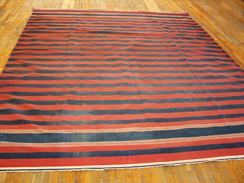 Not just a simple tapestry weave kilim piece in rose-red and dark blue stripes, but also with two ecru stripes with weft-float dot and line patterns. Dhurries generally do not employ additional weaving techniques. Vintage all-cotton Indian piece in