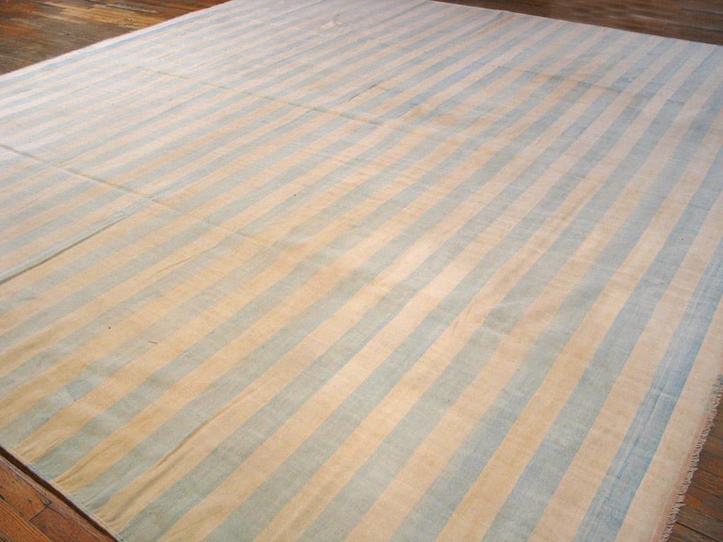 Sometimes the blue gets really pale, just a hint of sky in a borderless, edge-to-edge bitonal pattern on this all-cotton vintage Indian tapestry-woven carpet. Good condition.