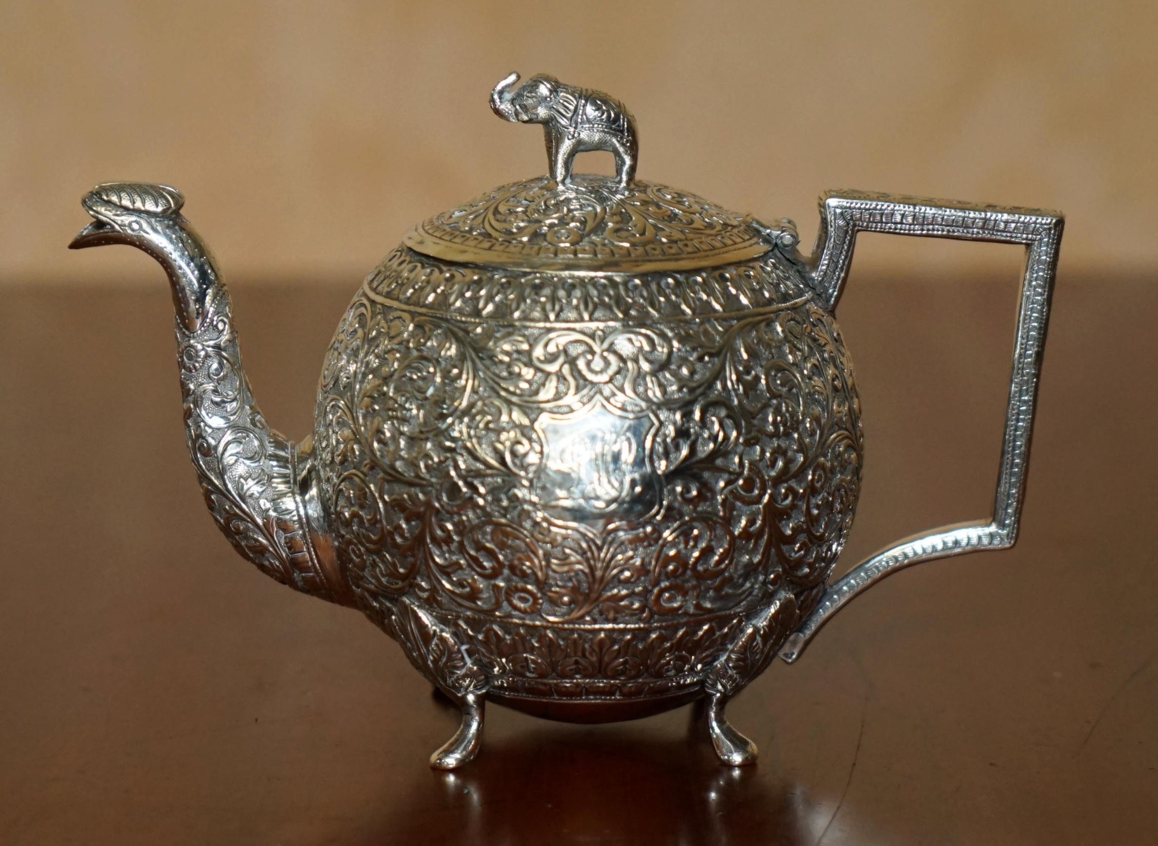 Royal House Antiques

Royal House Antiques is delighted to offer for sale this absolutely stunning original circa 1870 Indian Repoussé Colonial Solid Silver tea service attributed to Oomersi Mawji & Son’s depicting very rare Elephant finials

What a