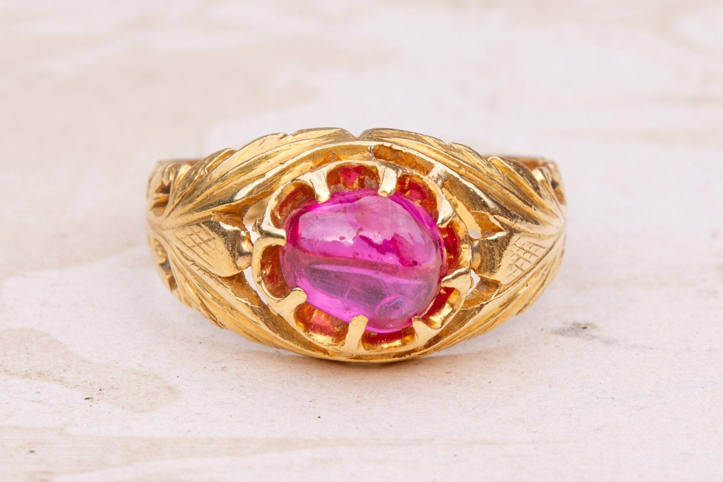 A scarce late Mughal period Indian gold and ruby ring dating from the mid-19th century.

The cabochon cut ruby is belcher set in an open-backed mount and weighs approximately 1ct. The ring is crafted in high-karat gold and the shoulders are