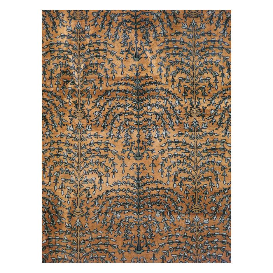 An antique Indian Lahore 9' x 12' room size rug handmade during the early 20th century featuring an all-over weeping willow tree pattern over a camel background.

The city of Agra was the Mughal capital from 1566-1569 and again from 1601-1658 and
