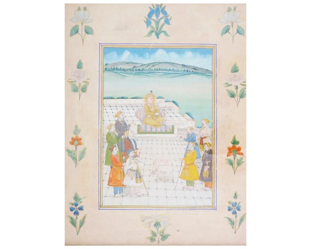 Eine antike Miniaturmalerei aus dem indischen Mogulreich, die mit Pigmenten ausgeführt und mit Goldfarbe auf Papier verziert ist, zeigt einen Raja in Gesellschaft von Adligen. Diese Moghul-Miniaturen sind berühmt für ihre akribische