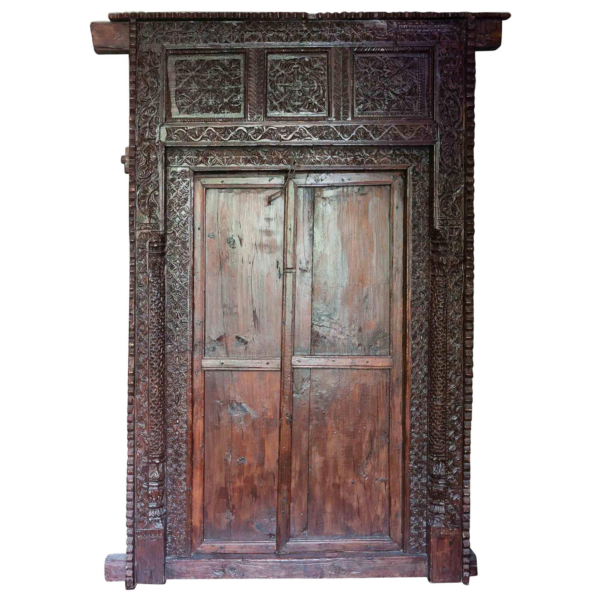 Antique Indian Ornately Carved Wooden Doors and Surrounding Frame