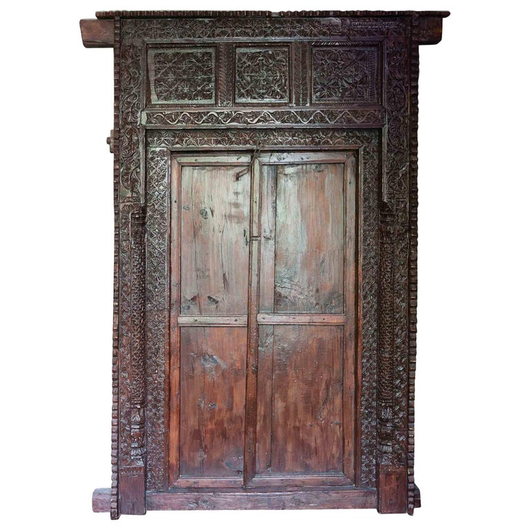 Antique Indian Ornately Carved Wooden Doors and Surrounding Frame at 1stDibs
