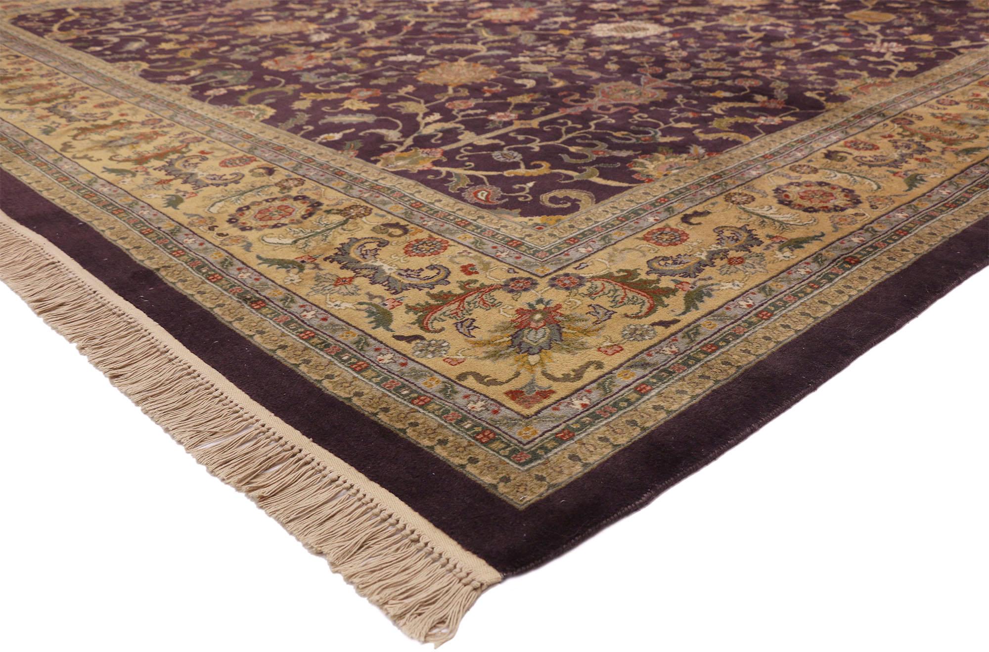 77316 Oversized Vintage Aubergine Indian Rug, 11'03 x 17'08. This oversized vintage Indian rug exudes the captivating allure of India with its mesmerizing design and rich color palette. Hand-knotted from wool, it boasts a lively botanical pattern