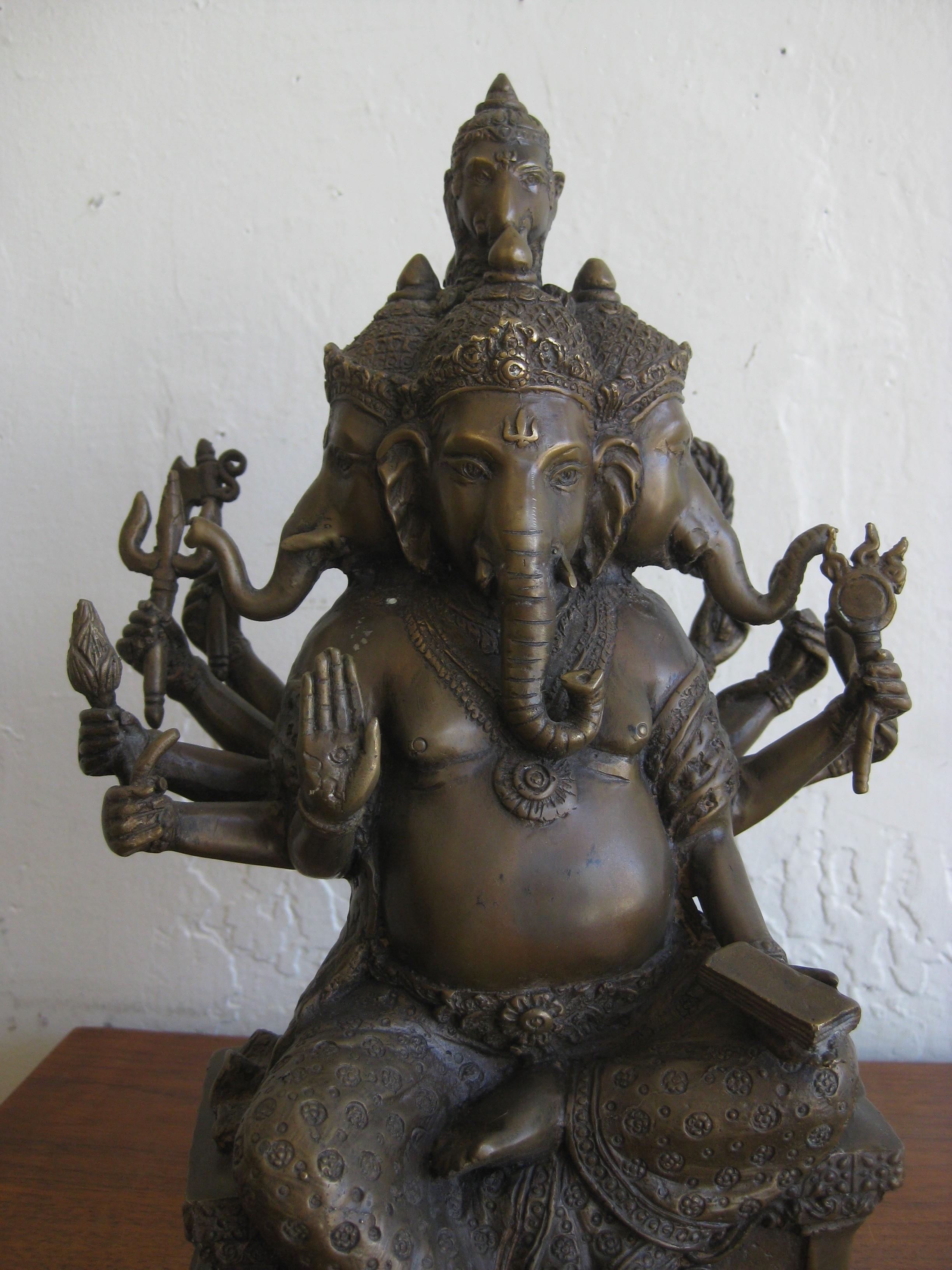 Fantastic antique Indian 10 arm and 5 head Panchmukhi Lord Ganesha deity bronze statue sculpture. Features Lord Ganesha with all his weapons. Very high quality bronze with awesome details. Cement filled. The bronze has a wonderful dark patina. In