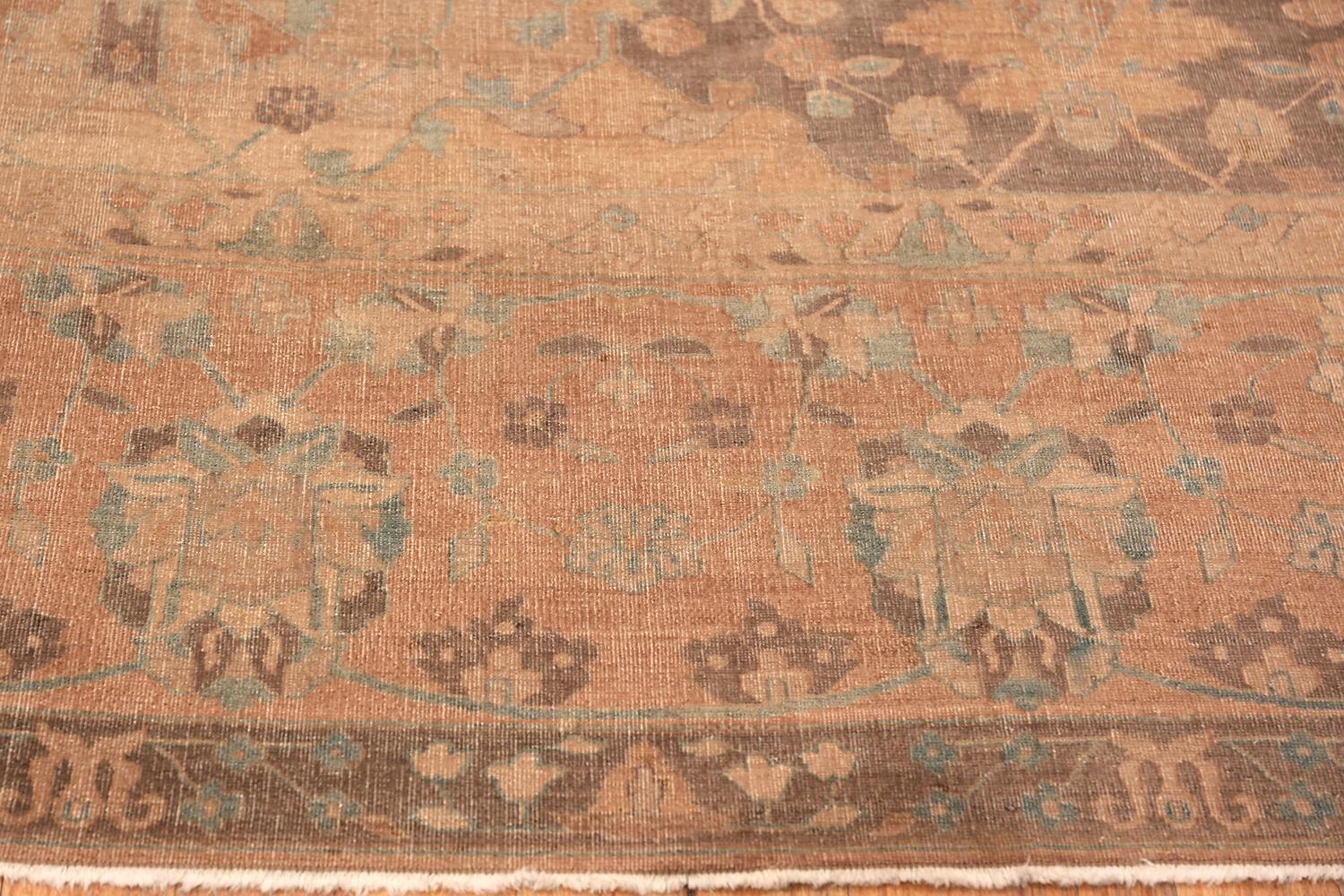 Antique Indian rug, country of origin: India, date circa 1900. Size: 13 ft 3 in x 16 ft 10 in (4.04 m x 5.13 m). This gorgeous, earth-toned antique Indian rug was created around the turn of the 20th century. It features a garden design that is the