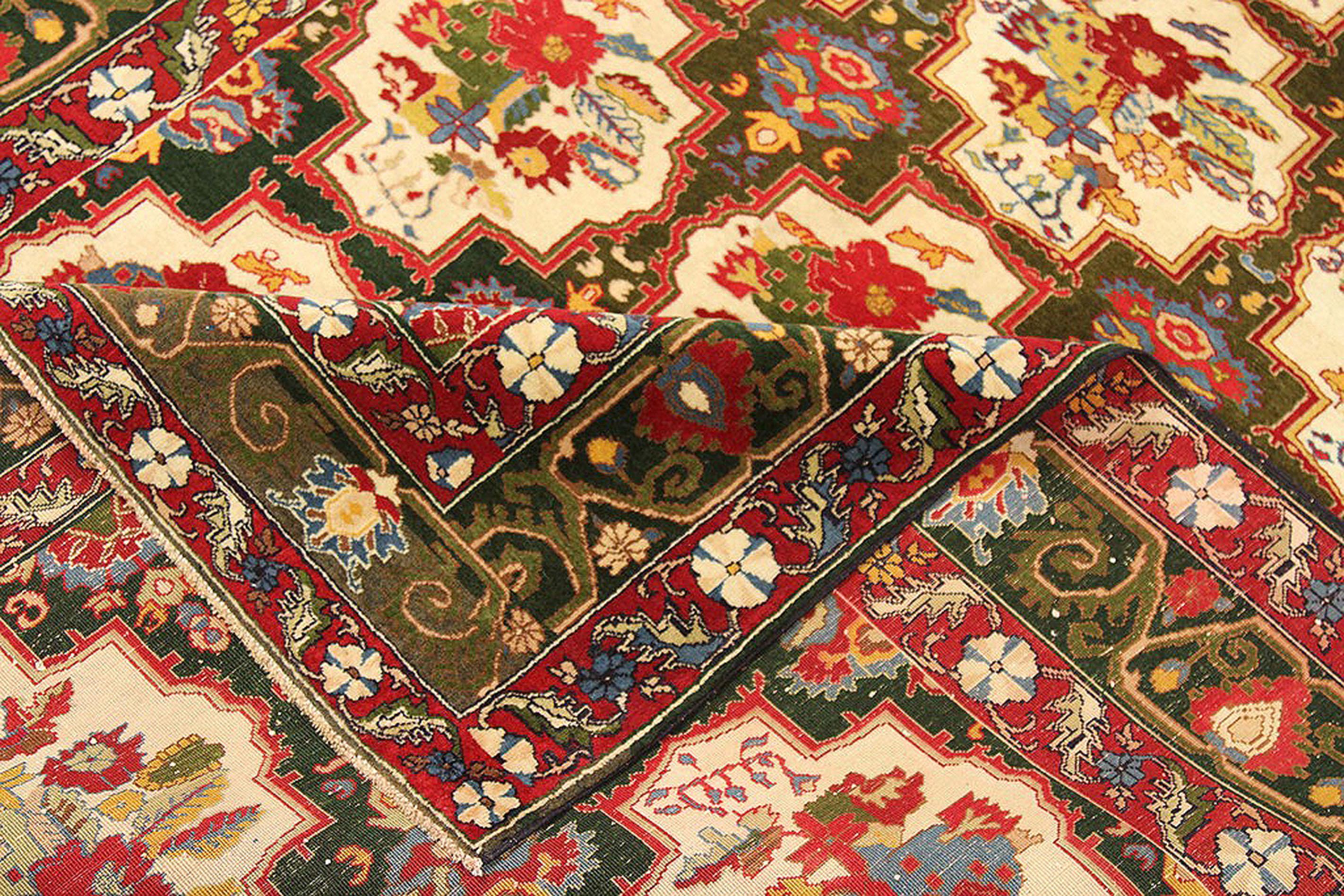 Antique Indian rug handmade from the finest sheep’s wool and colored with all-natural vegetable dyes that are safe for humans and pets. It’s a traditional Indian rug design featuring a lovely mix of a red and black field with gold, blue, red, and