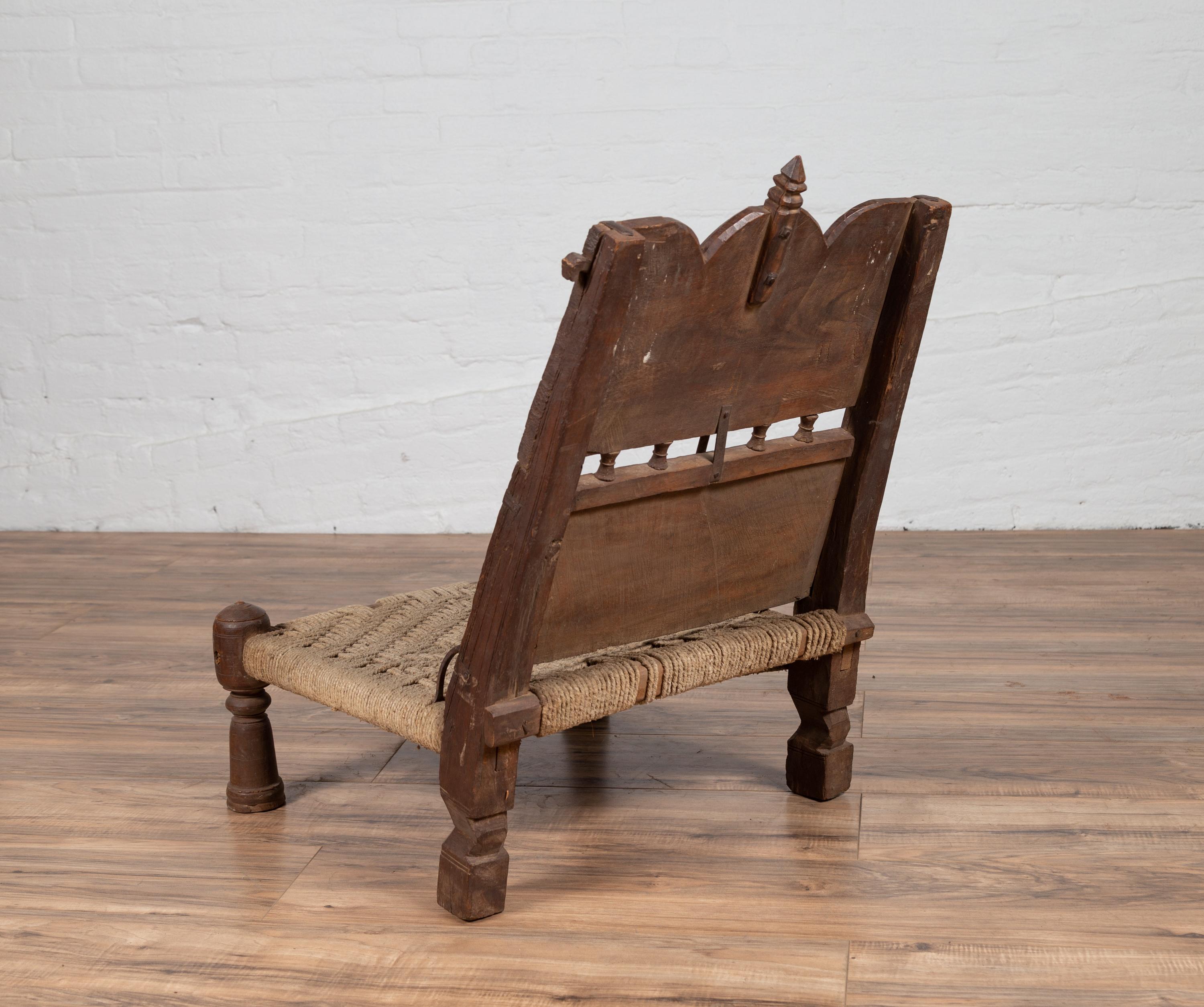 Antique Indian Rustic Low Seat Wooden Chair with Carved Rosettes and Twine Seat For Sale 5