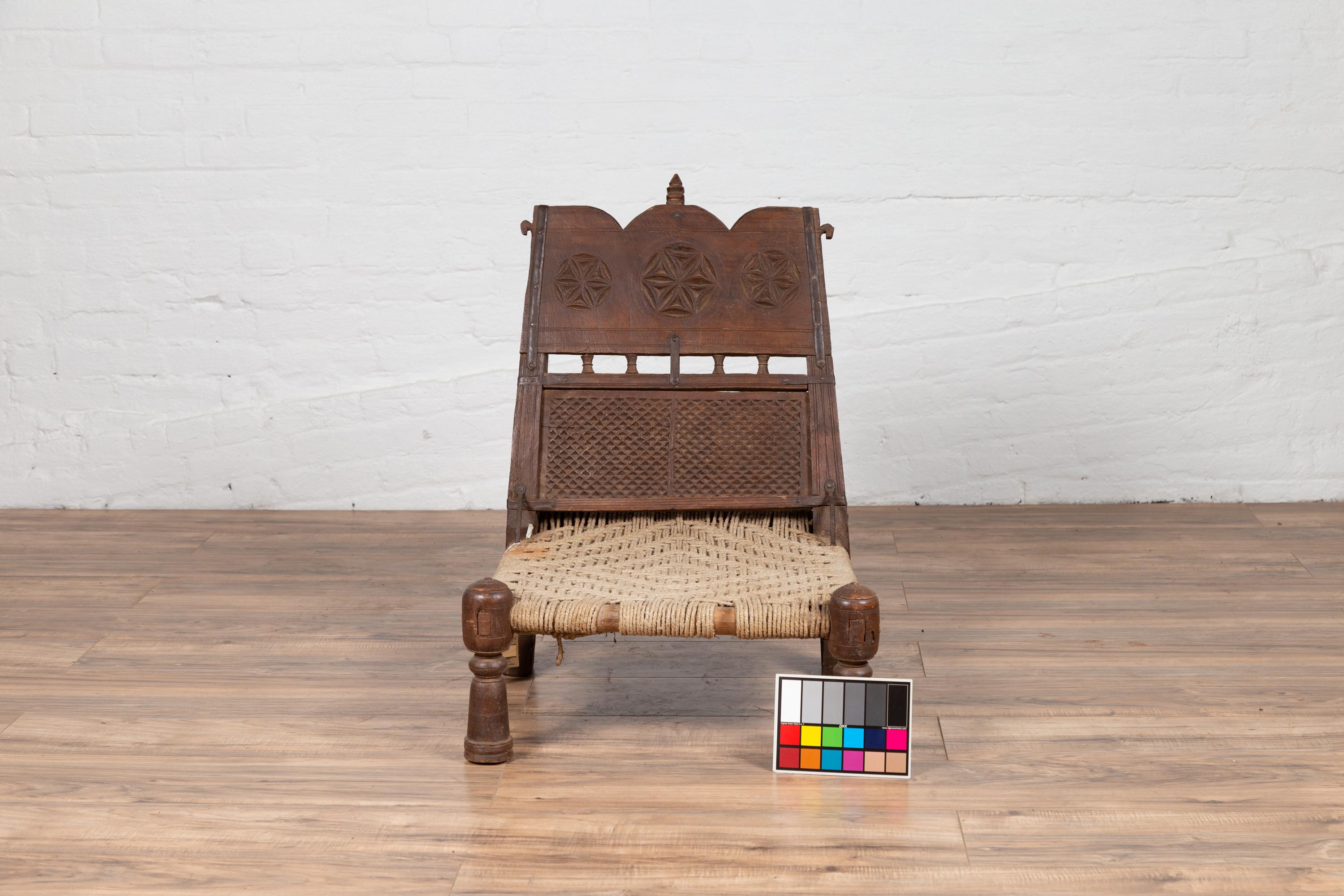 Antique Indian Rustic Low Seat Wooden Chair with Carved Rosettes and Twine Seat For Sale 7