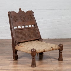 Antique Indian Rustic Low Seat Wooden Chair with Carved Rosettes and Twine Seat