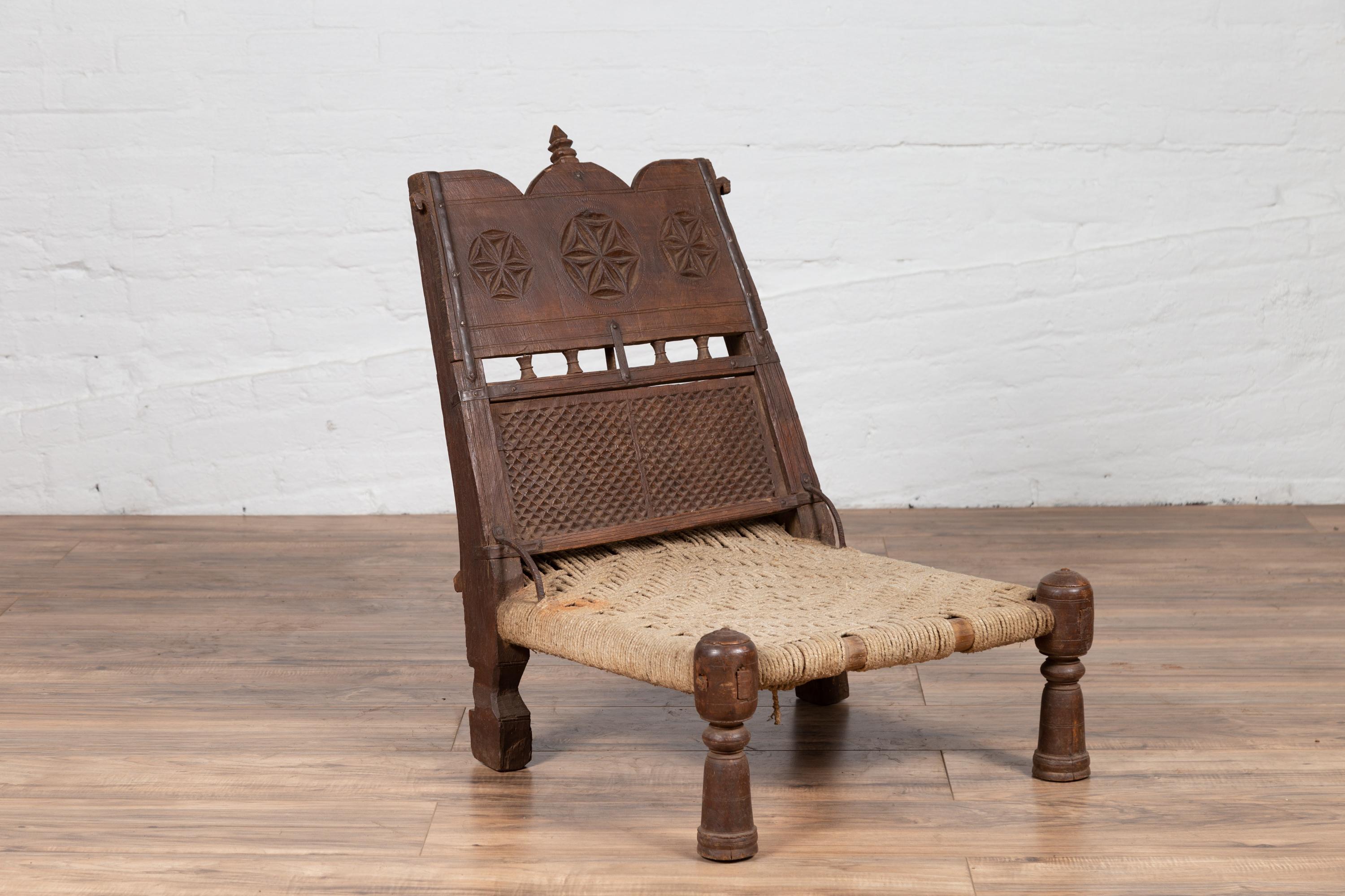 Antique Indian Rustic Low Seat Wooden Chair with Carved Rosettes and Twine Seat For Sale 1