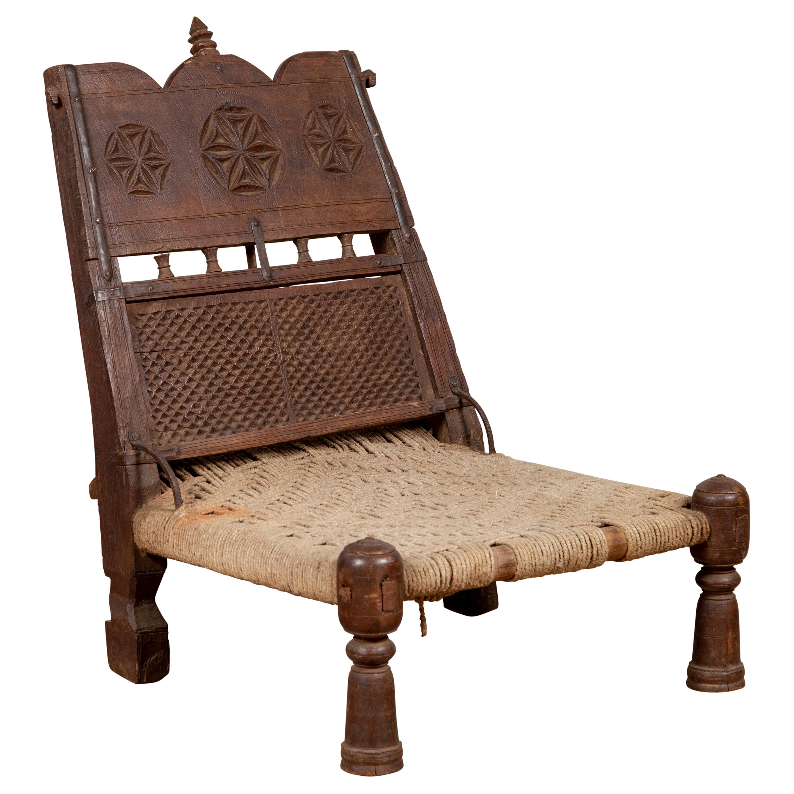 Antique Indian Rustic Low Seat Wooden Chair with Carved Rosettes and Twine Seat