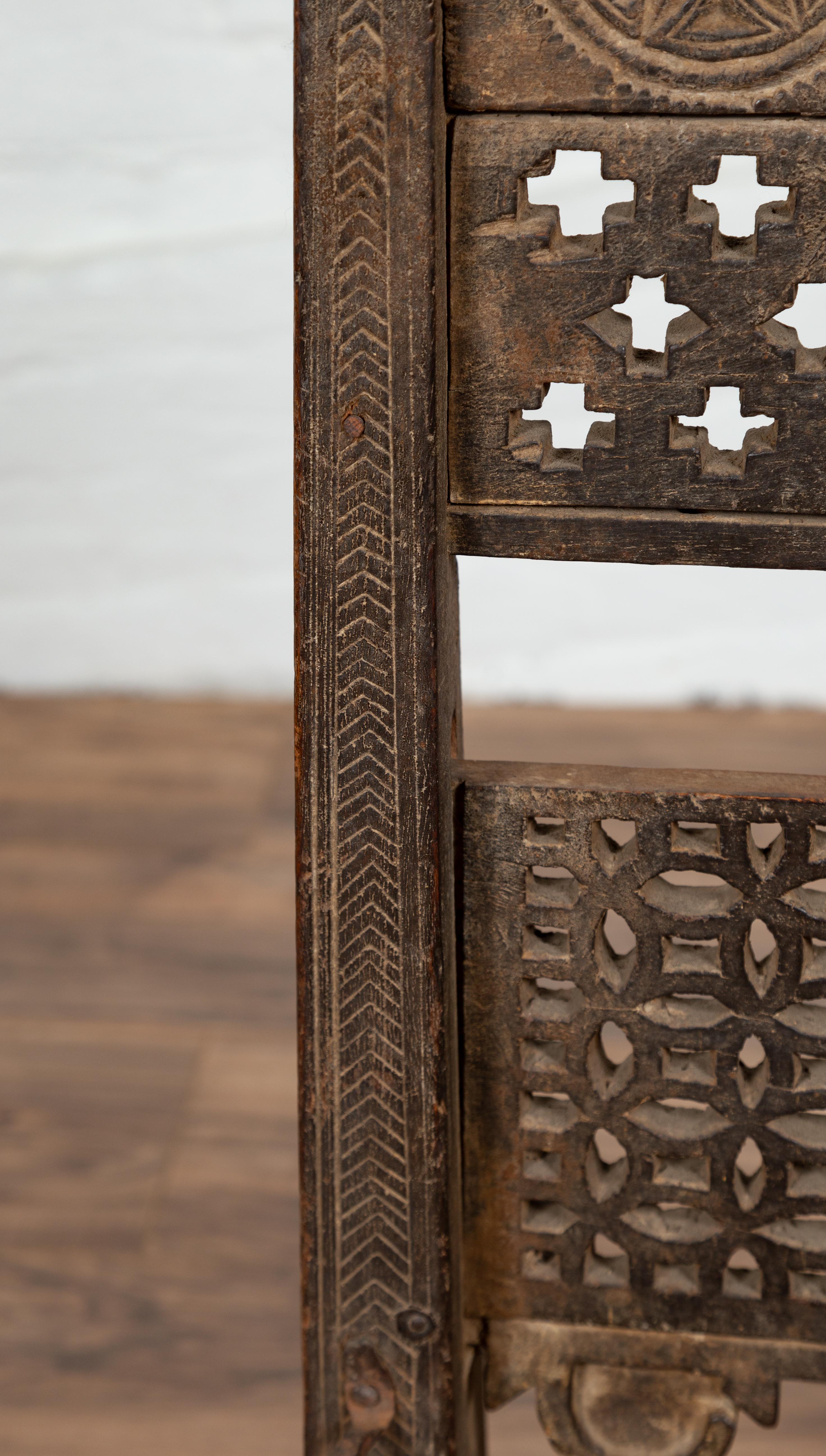Antique Indian Rustic Low Seat Wooden Chair with Fretwork Accents and Rosettes For Sale 1