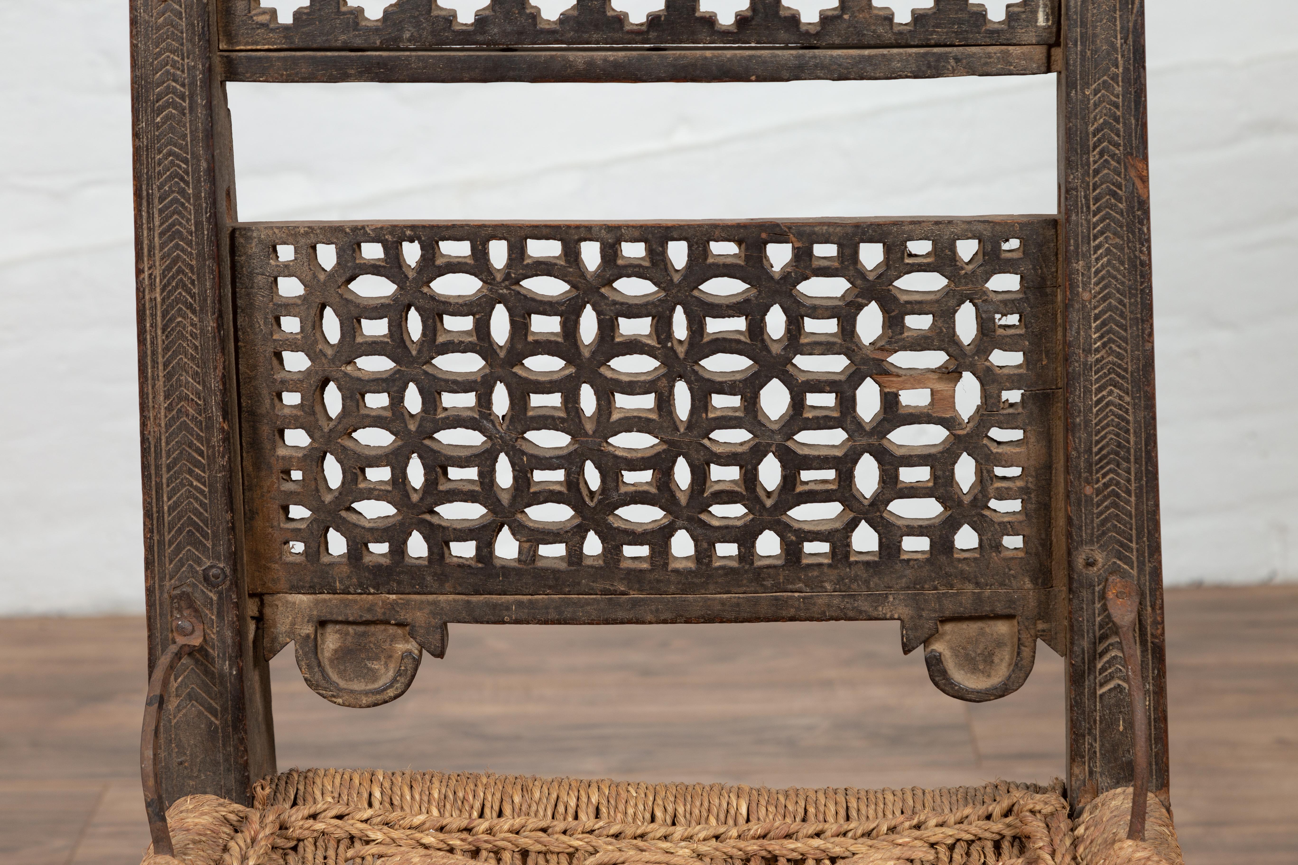 Antique Indian Rustic Low Seat Wooden Chair with Fretwork Accents and Rosettes For Sale 3