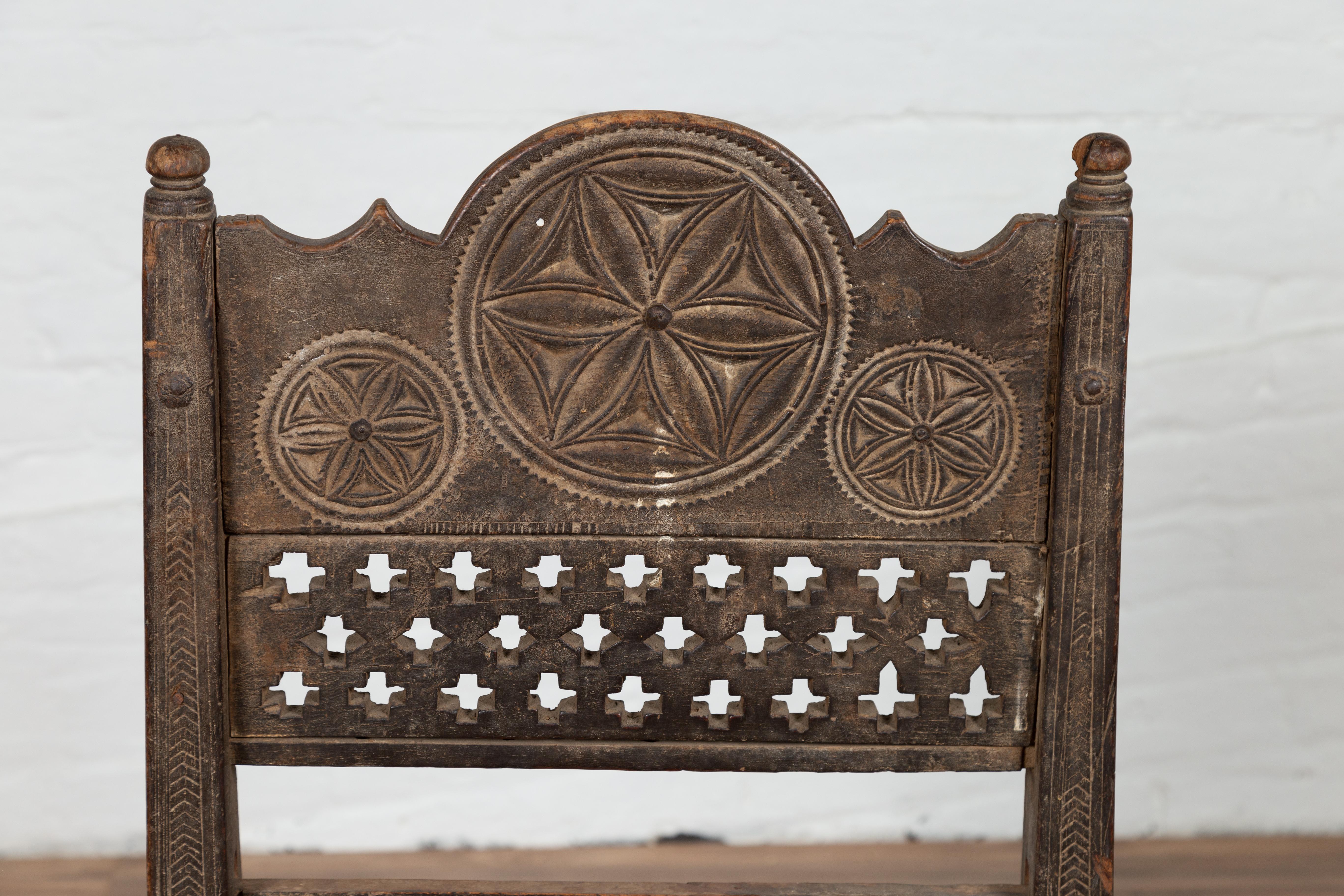 Antique Indian Rustic Low Seat Wooden Chair with Fretwork Accents and Rosettes For Sale 6