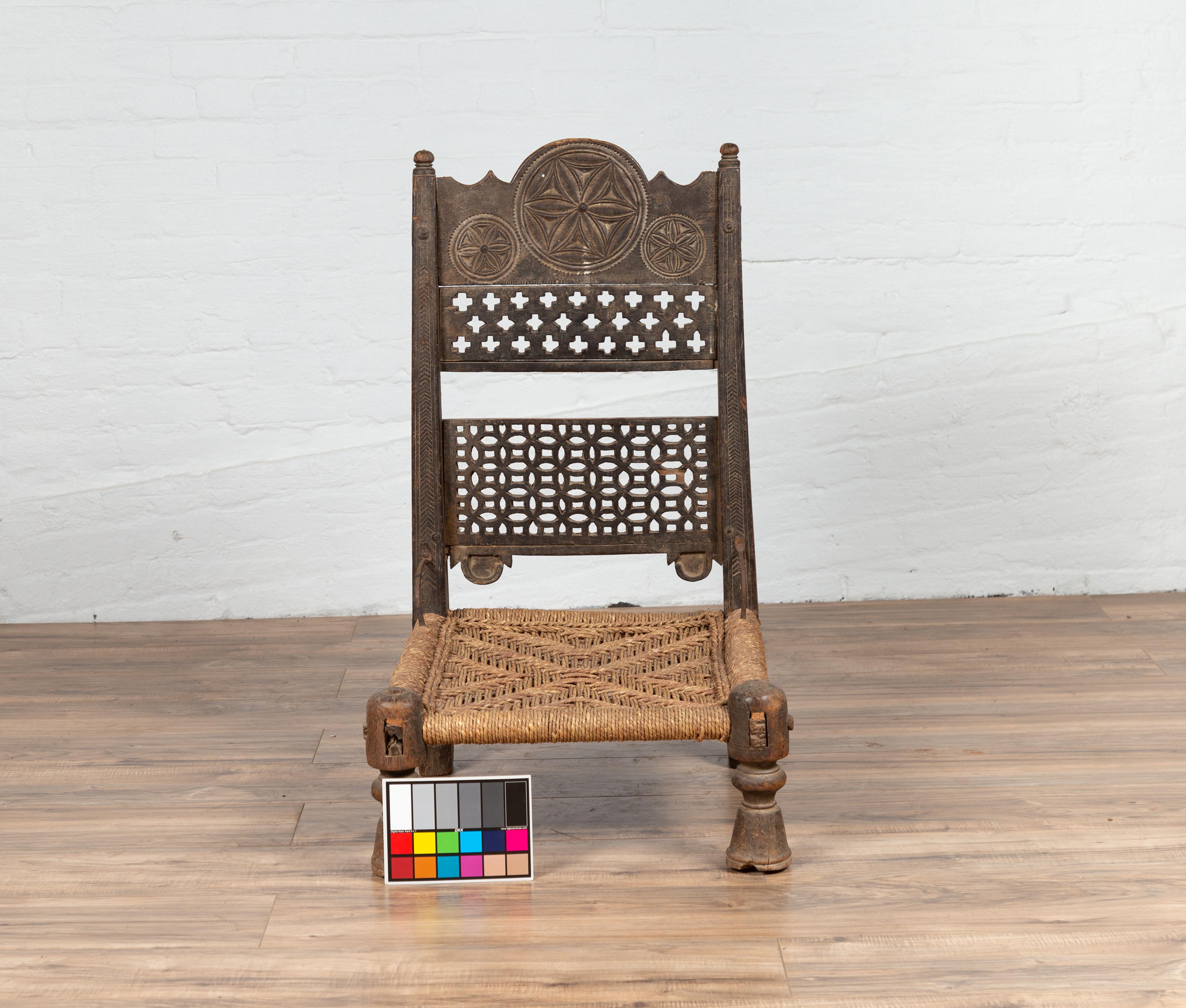 Antique Indian Rustic Low Seat Wooden Chair with Fretwork Accents and Rosettes For Sale 7