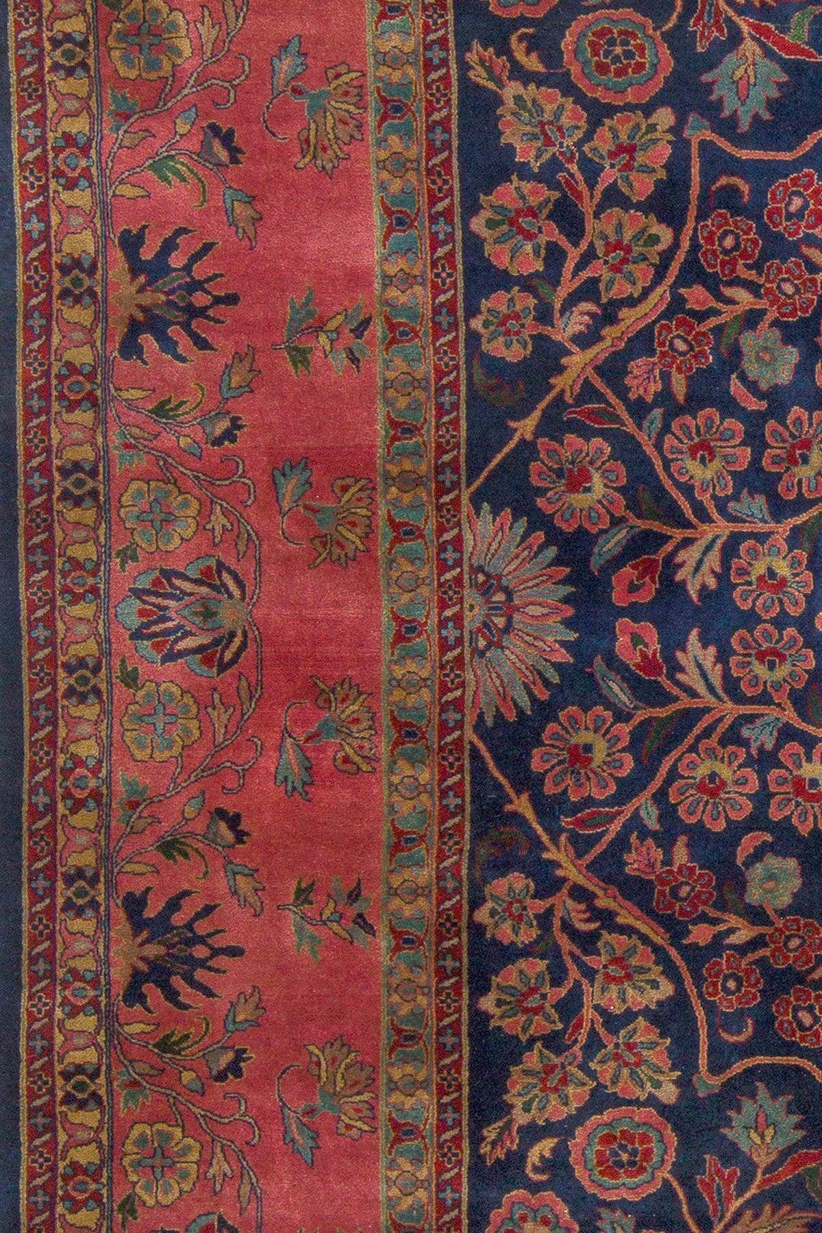 An early 20th century antique Indo Sarouk rug woven with rich lustrous wool.

This rug was woven in northern India from an example of a antique Persian sarouk rug. The wool construction and patina is different, with this having a silkier sheen to