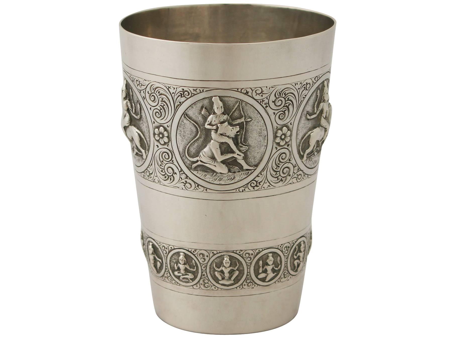 A fine and impressive antique Indian silver beaker, an addition to our Asian silverware collection.

This impressive antique Indian silver beaker has a plain cylindrical, tapering form.

The surface of the beaker is encircled with a broad band